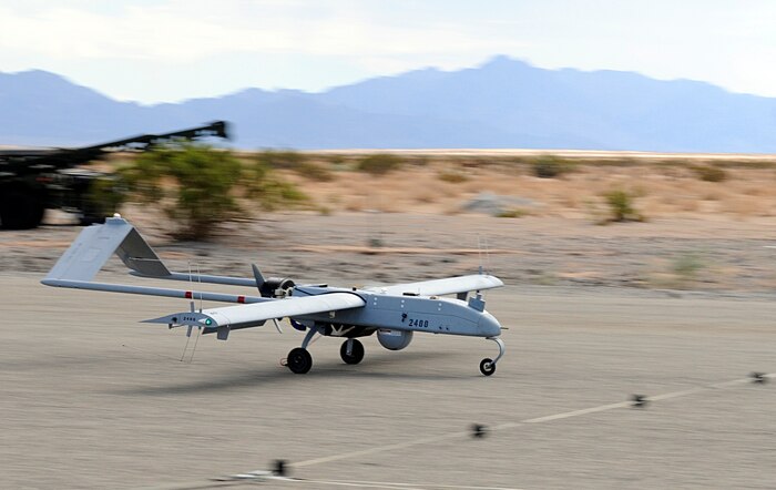 An RQ-7B Shadow unmanned aircraft lands after Marine Unmanned Aerial Vehicle Squadron 4's inaugural flight at Auxiliary Airfield 2 in Yuma, Ariz., Sept. 29, 2010. During the flight, the squadron showcased the aircraft’s reconnaissance and surveillance capabilities with a live video feed from the Shadow’s onboard camera. The Yuma detachment of the Texas-based reserve squadron is the only operational component of the unit and is composed of mostly full-time Marines. The detachment, which began assembling in Yuma in June, has four Shadows and consists of approximately 40 Marines.