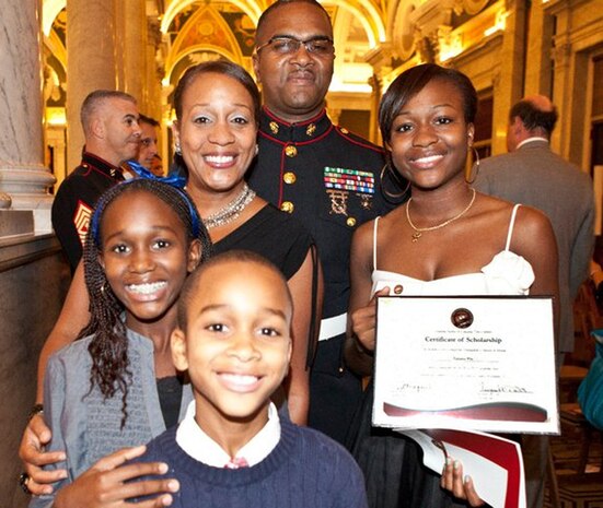 Tatiana Pile (right), daughter of Gunnery Sergeant Claude Pile (center back) was one of 24 students awarded a Marine Corps Scholarship Foundation Scholarship at the Great Hall of the Library of Congress in September. Her father is assigned to Systems Engineering, Interoperability, Architecture and Technology.