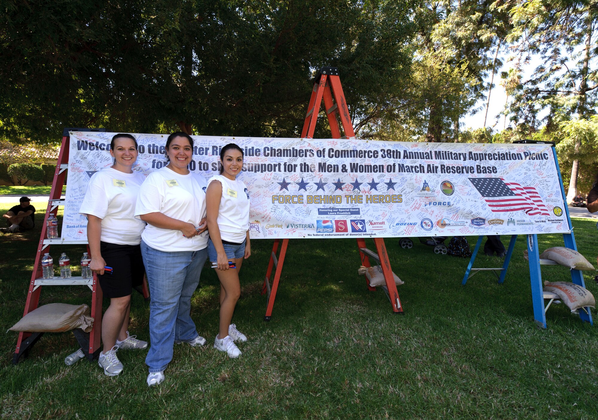 Tabatha Boners, Jackie Walker, Christina Solano, Bank of America volunteers, help with the activities during the 38th Annual Military Appreciation Picnic at March Air Reserve Base, Calif., Sept. 18. (U.S. Air Force photo by Staff Sgt. Matthew Smith)