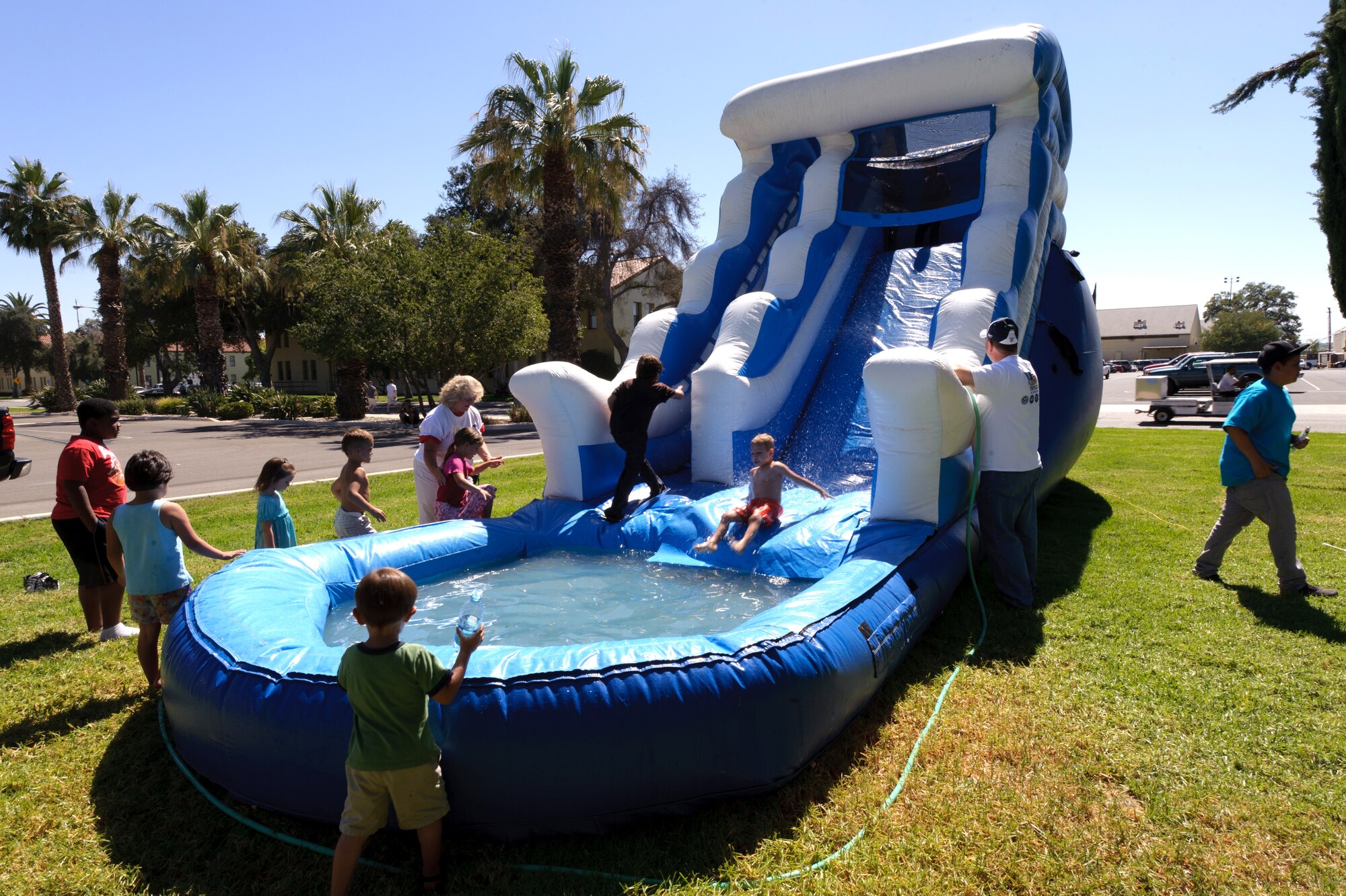 Children enjoy the water slide during the 38th Annual Military Appreciation Picnic at March Air Reserve Base, Calif., Sept. 18. (U.S. Air Force photo by Staff Sgt. Matthew Smith)