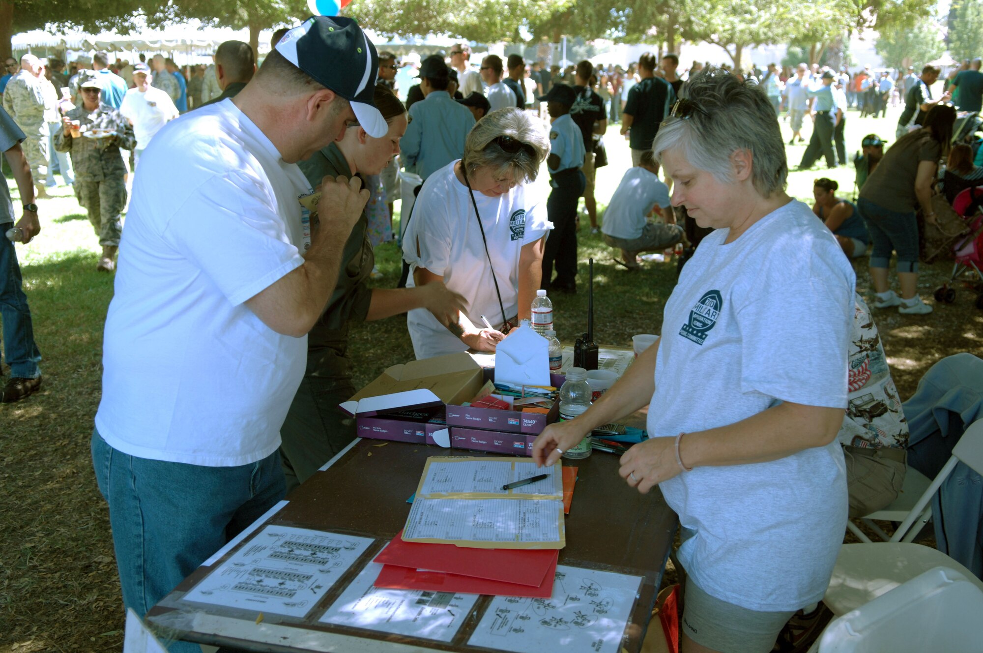 Volunteers sign in during the 38th Annual Military Appreciation Picnic at March Air Reserve Base, Calif., Sept. 18. (U.S. Air Force photo by  SSgt. Keith Lawson)