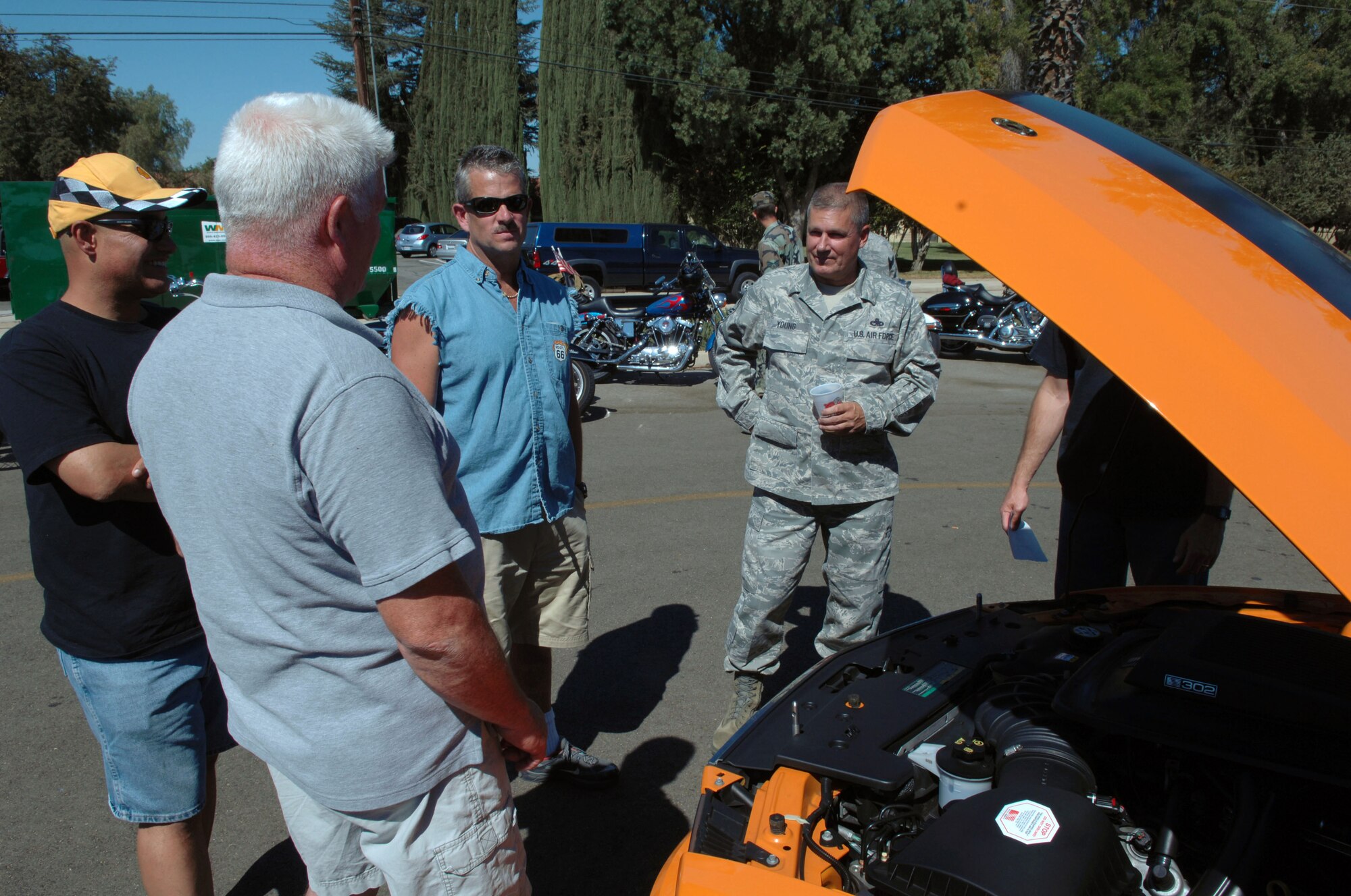 Muscle car fans show their support at a car show during the 38th Annual Military Appreciation Picnic at March Air Reserve Base, Calif., Sept. 18. (U.S. Air Force photo by  SSgt. Keith Lawson)