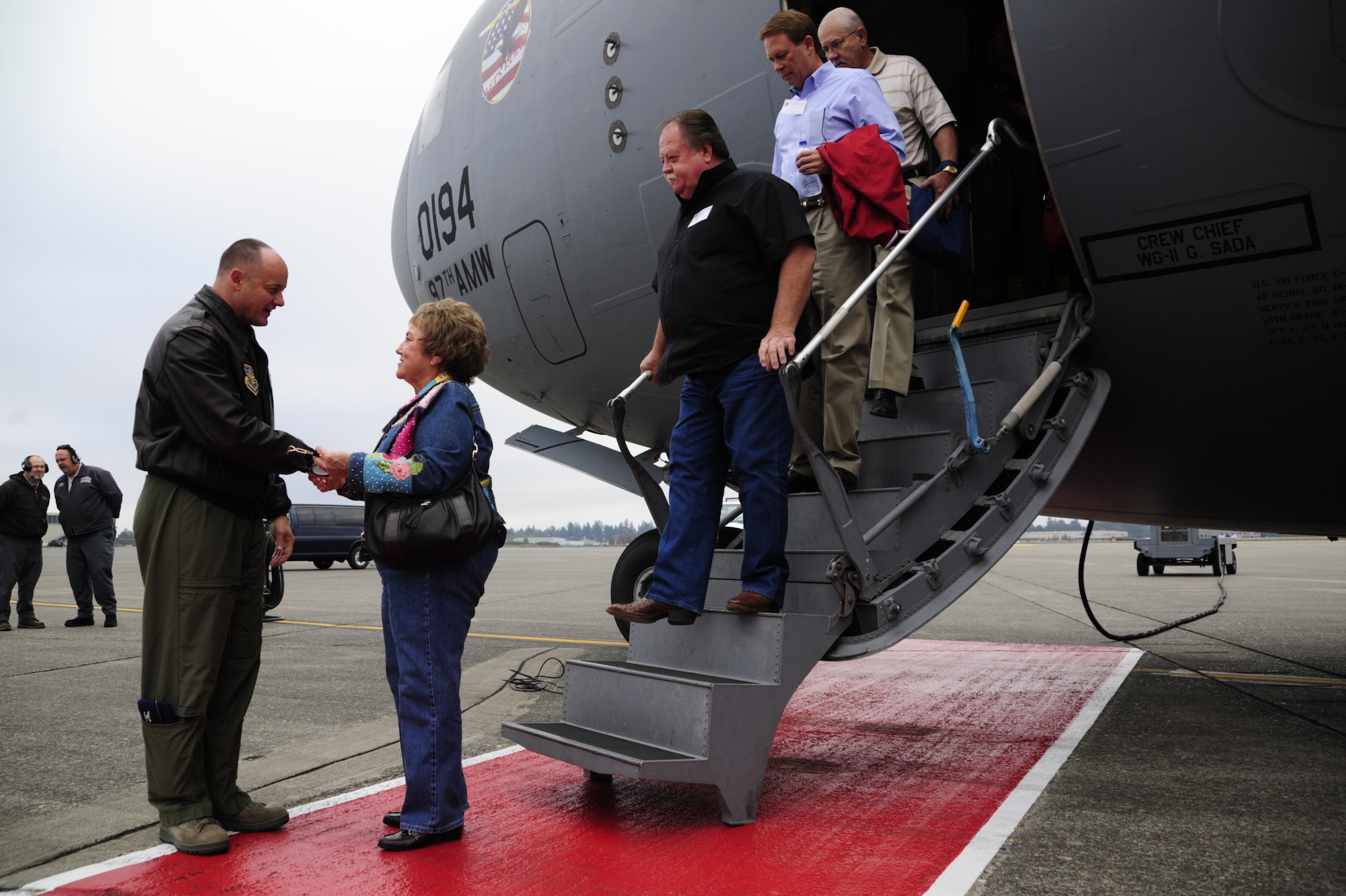 Col. Kevin Kilb, 62nd Airlift Wing Commander, greets visitors during a civic leader tour Sept. 30 at Joint Base Lewis-McChord, Wash. Civic leader/ employer tours are organized in order to spread mission awareness, foster liaisons between civilian and military leadership and to highlight the importance of the roles the community and families play in the lives of Airmen. (U.S. Air Force Photo/Airman Leah Young)