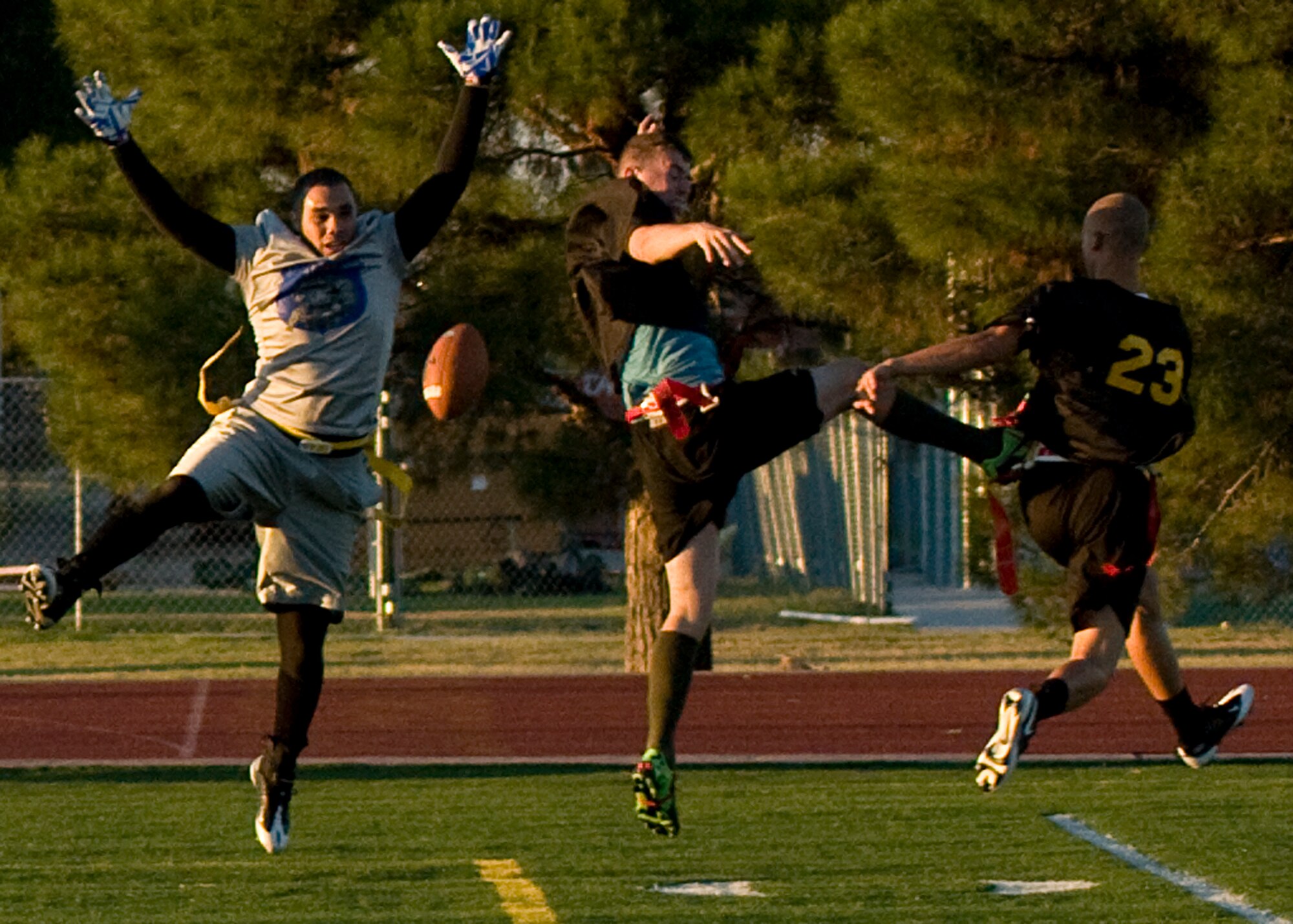 GOODFELLOW AIR FORCE BASE, Texas -- 17th Mission Support Group Junk Yard Dog receiver, Jamie Burdette; 344th Army defenders Darrell Sears and Greg Ray react to an interrupted pass during intramural play at the base football field Sept. 27. A last second touchdown by Army tied the game at 13-13, forcing overtime. With four downs each, the Junk Yard Dogs were able to outplay Army by 23-yards, helping to secure a 1-point lead. The Dogs advanced to play Army again for the championship. (U.S. Air Force photo/ Senior Airman Tong Duong)