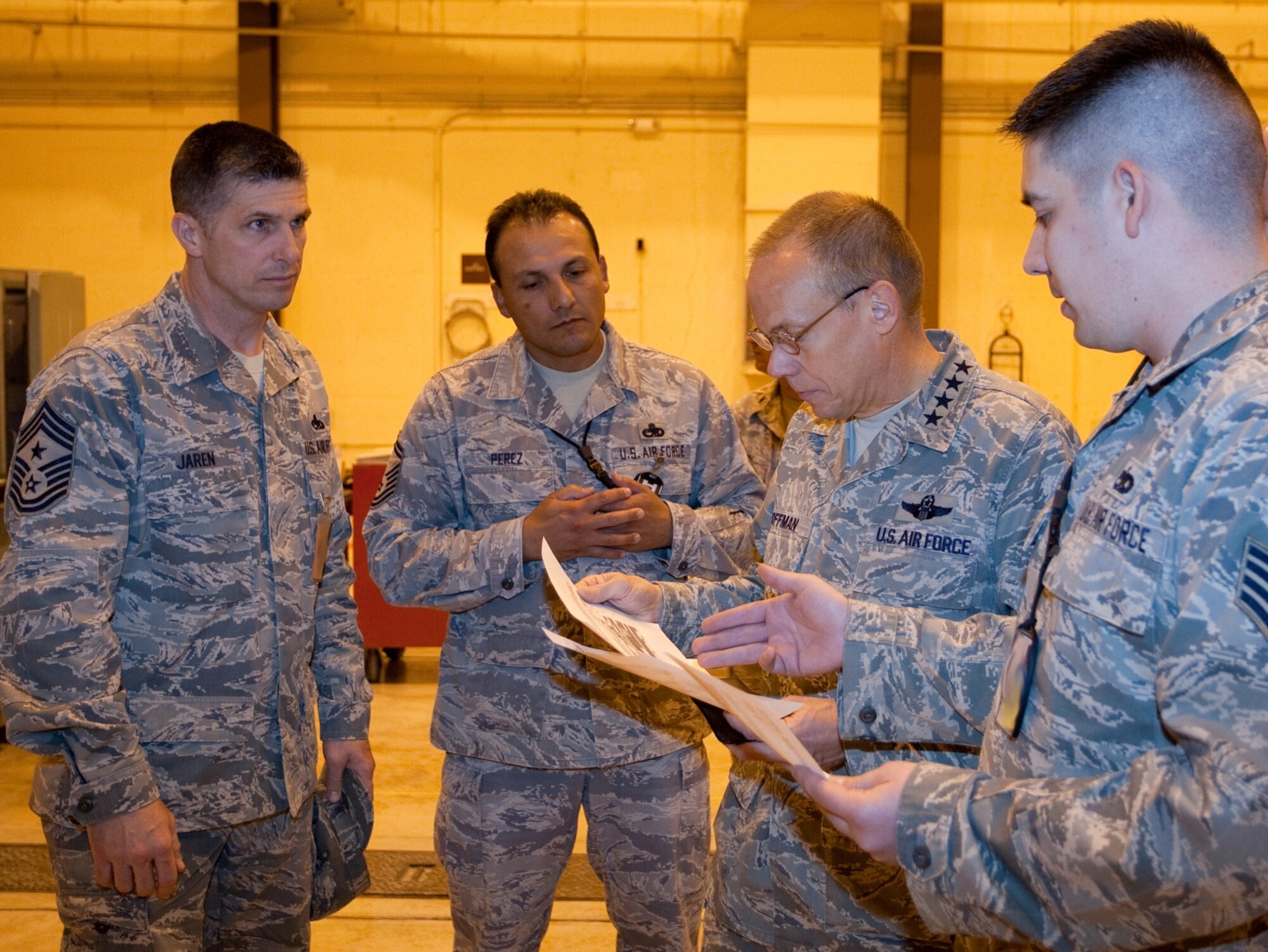 General Donald Hoffman, Air Force Materiel Command commander,  looks over a maintenance capability letter with Chief Master Sgt. Eric Jaren, AFMC command chief; Senior Master Sgt. Julio Perez, Staff Sgt.  Craig Helvie and Chief Master Sgt. Ray Guest, all three with the 15th Munitions Squadron. General Hoffman took time to visit the 15th MUNS, a tenant unit here. The unit stood up in August of 2009 moving critical weapon system maintenance and storage responsibilities under Air Force Materiel Command. (U.S. Air Force photo by Jeff Allred)