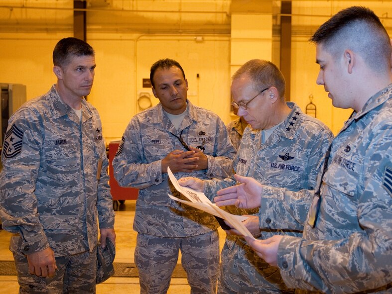 General Donald Hoffman, Air Force Materiel Command commander,  looks over a maintenance capability letter with Chief Master Sgt. Eric Jaren, AFMC command chief; Senior Master Sgt. Julio Perez, Staff Sgt.  Craig Helvie and Chief Master Sgt. Ray Guest, all three with the 15th Munitions Squadron. General Hoffman took time to visit the 15th MUNS, a tenant unit here. The unit stood up in August of 2009 moving critical weapon system maintenance and storage responsibilities under Air Force Materiel Command. (U.S. Air Force photo by Jeff Allred)