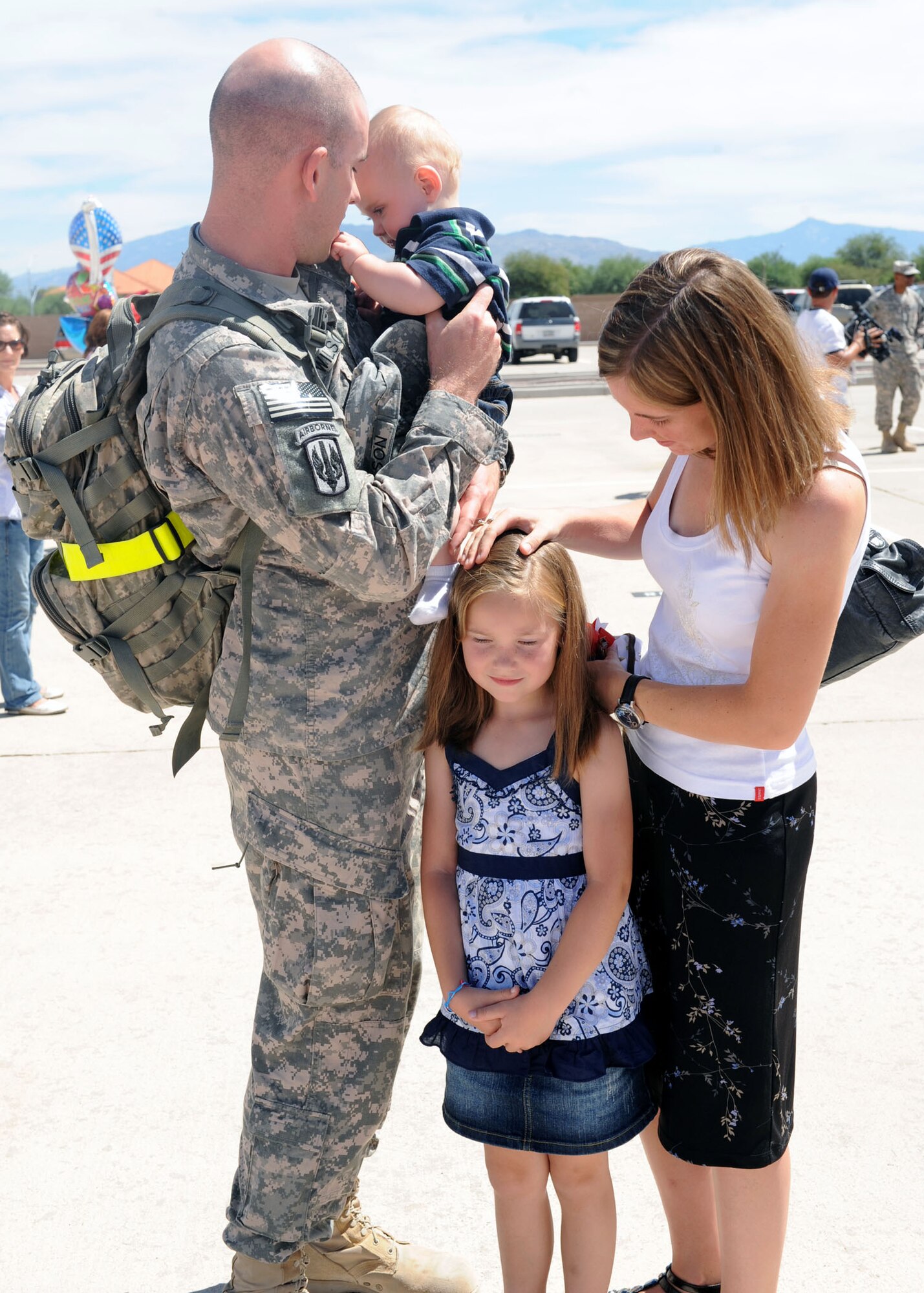Sgt. 1st Class Robert Wilson reunites with his wife Sandra, daughter
Lea, and son Braydon after returning from a 365-day deployment. (U.S. Air Force photo/Senior Airman Brittany Dowdle)