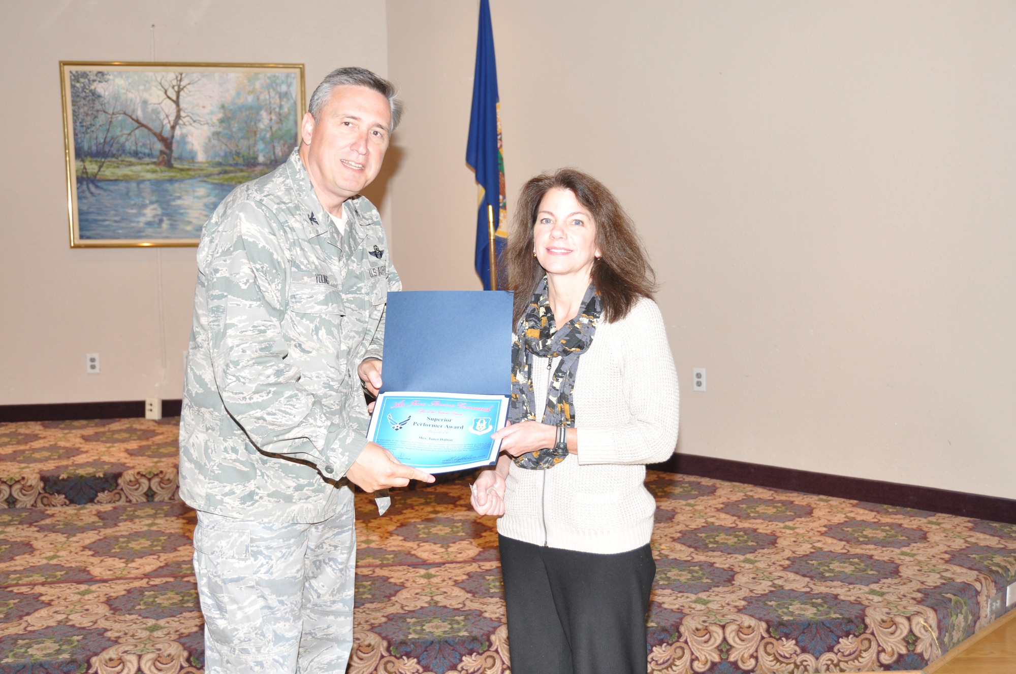 Ms. Jan Dalton receives her superior performer award from Col. Darrell G. Young, 934th Airlift Wing commander, at the post inspection recognition luncheon Sept. 28. (Air Force Photo/Paul Zadach)