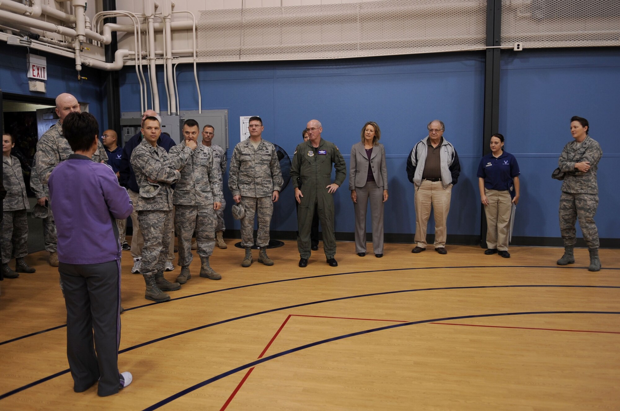 Carol Muir(left), 319th Force Support Squadron, shows the newly renovated gym to members of Grand Forks Air Force Base during the reopening of gym two at the Fitness Center Sept. 30 Grand Forks AFB. The gym was closed for four months due to a 1 million dollar renovation project. (U.S. Air Force photo by Senior Airman Amanda N. Stencil)