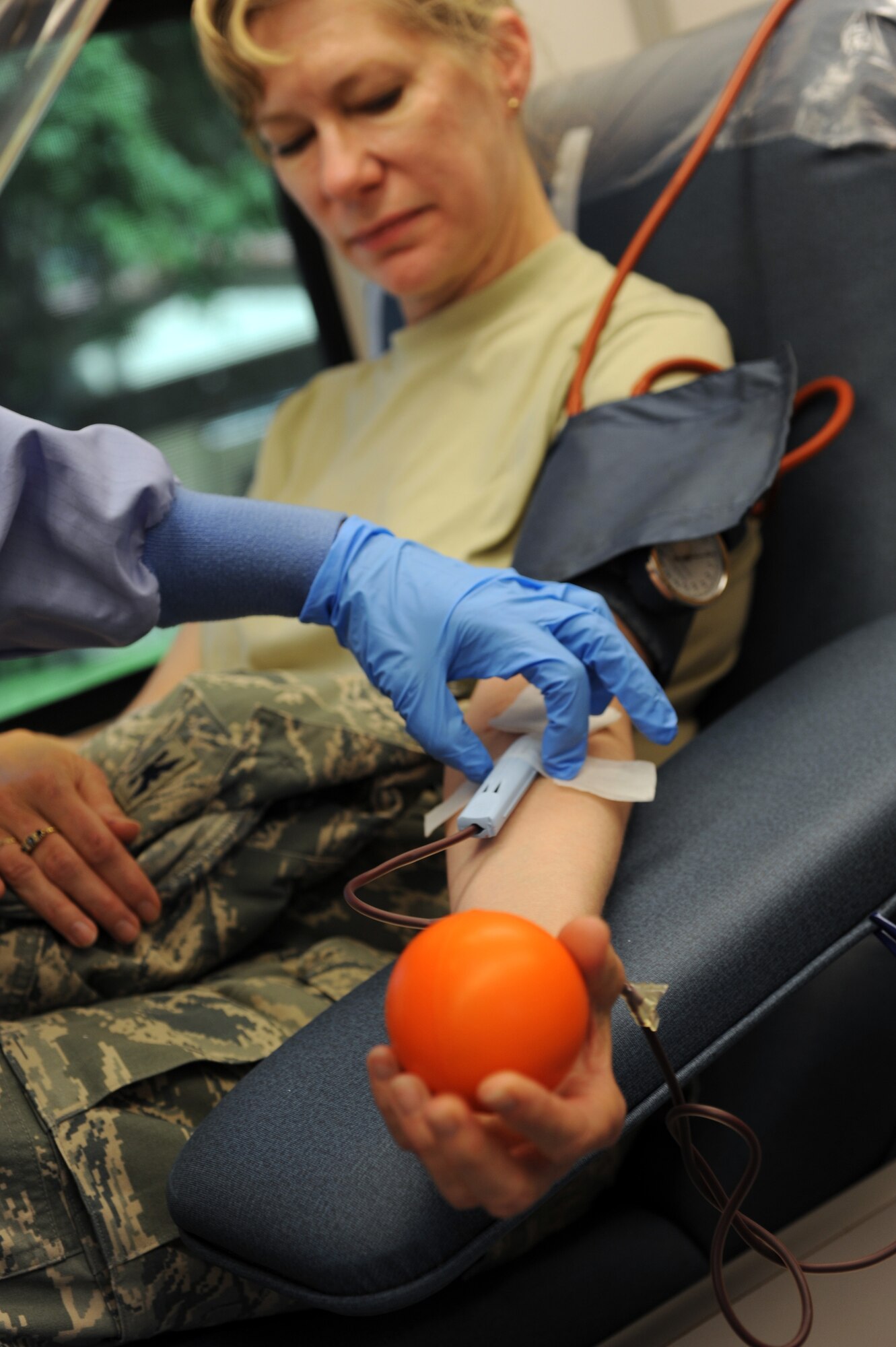 Col. Mary Lussier, 752nd Medical Squadron commander, donates blood at the March Air Reserve Base Blood Drive Sept. 18. Assisting her is Guiliana Nachkova, a phlebotomist from Naval Medical Center San Diego. (U.S. Air Force photo by Tech. Sgt. Christine Jones)