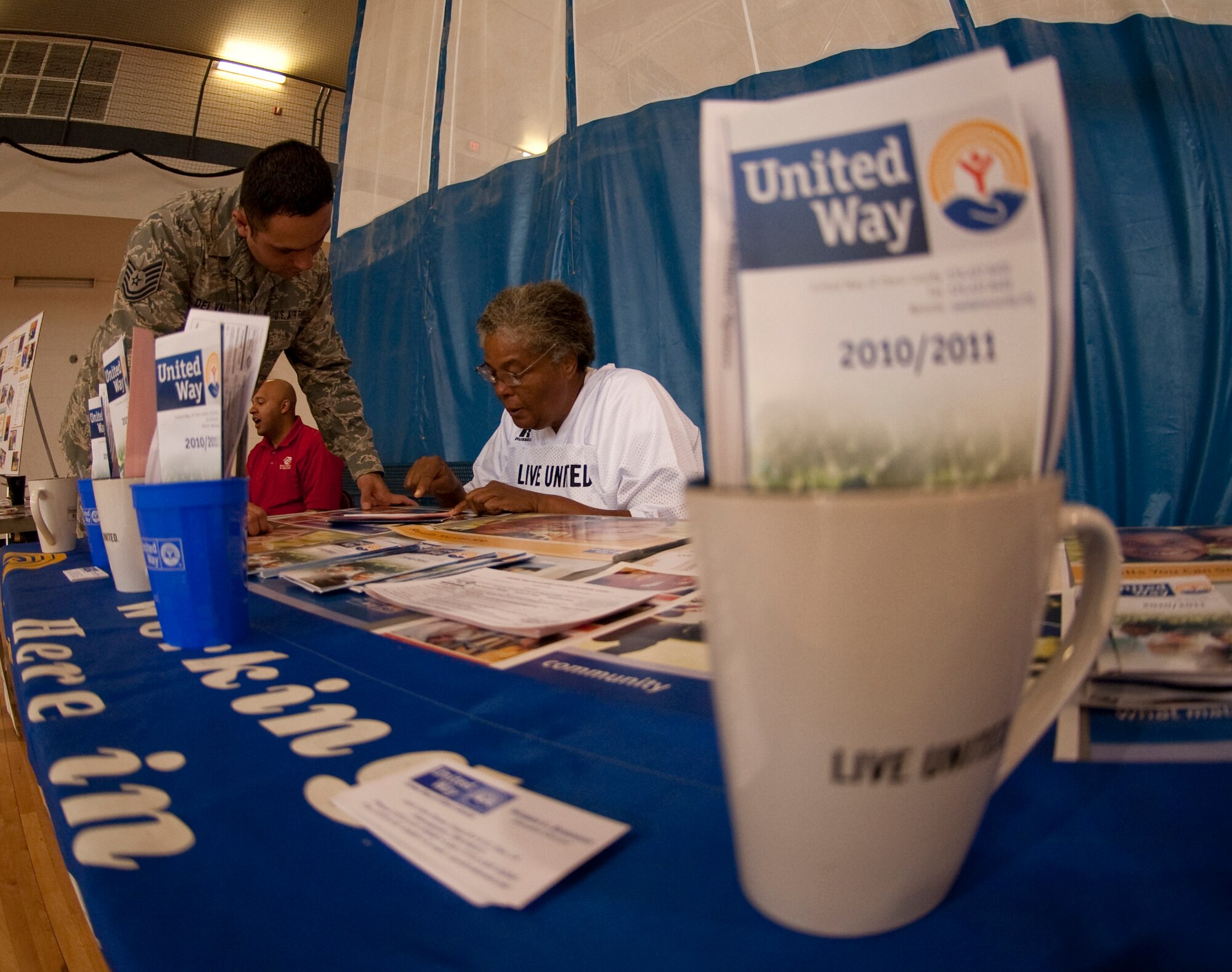 HOLLOMAN AIR FORCE BASE, N.M. -- Tech. Sgt. Jose Del Val, 49th Logistics Readiness Squadron, speaks to Mabel Blackwell of the United Way during the 2010 Combined Federal Campaign Kick Off at the Domenici Fitness and Sports Center Sept. 24, 2010. The United Way partnered with the CFC Local Federal Coordinating Committee to bring the campaign to Holloman. According to their official Web site, the CFC is the world's largest and most successful annual workplace charity campaign that helps raise millions of dollars each year for non-profit organizations providing health and human service benefits throughout the world. This year's CFC goal at Holloman is higher than ever before at $100,000. (U.S. Air Force photo by Senior Airman Sondra Escutia / Released)