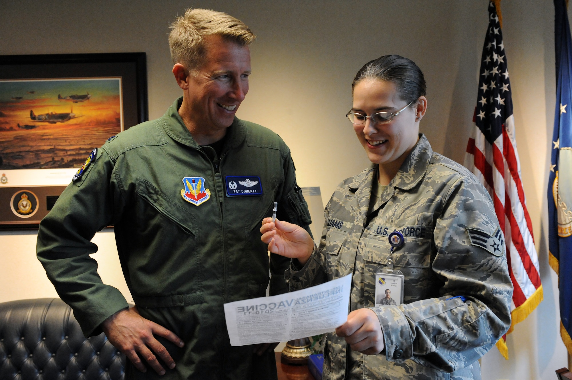 SEYMOUR JOHNSON AIR FORCE BASE, N.C. -- Col. Patrick Doherty recieves a vaccination briefing from Senior Airman Bridget Williams prior to receiving the flu mist here, Sept. 30, 2010. This year, Airmen are only required to get one shot and not the two separate doses needed last year to protect against seasonal influenza and H1N1. Colonel Doherty is Commander of the 4th Fighter Wing. Airman Williams, 4th Medical Group aerospace medical technician, hails from Little Falls, Minn. (U.S. Air Force photo/Staff Sgt. Courtney Richardson) (RELEASED)