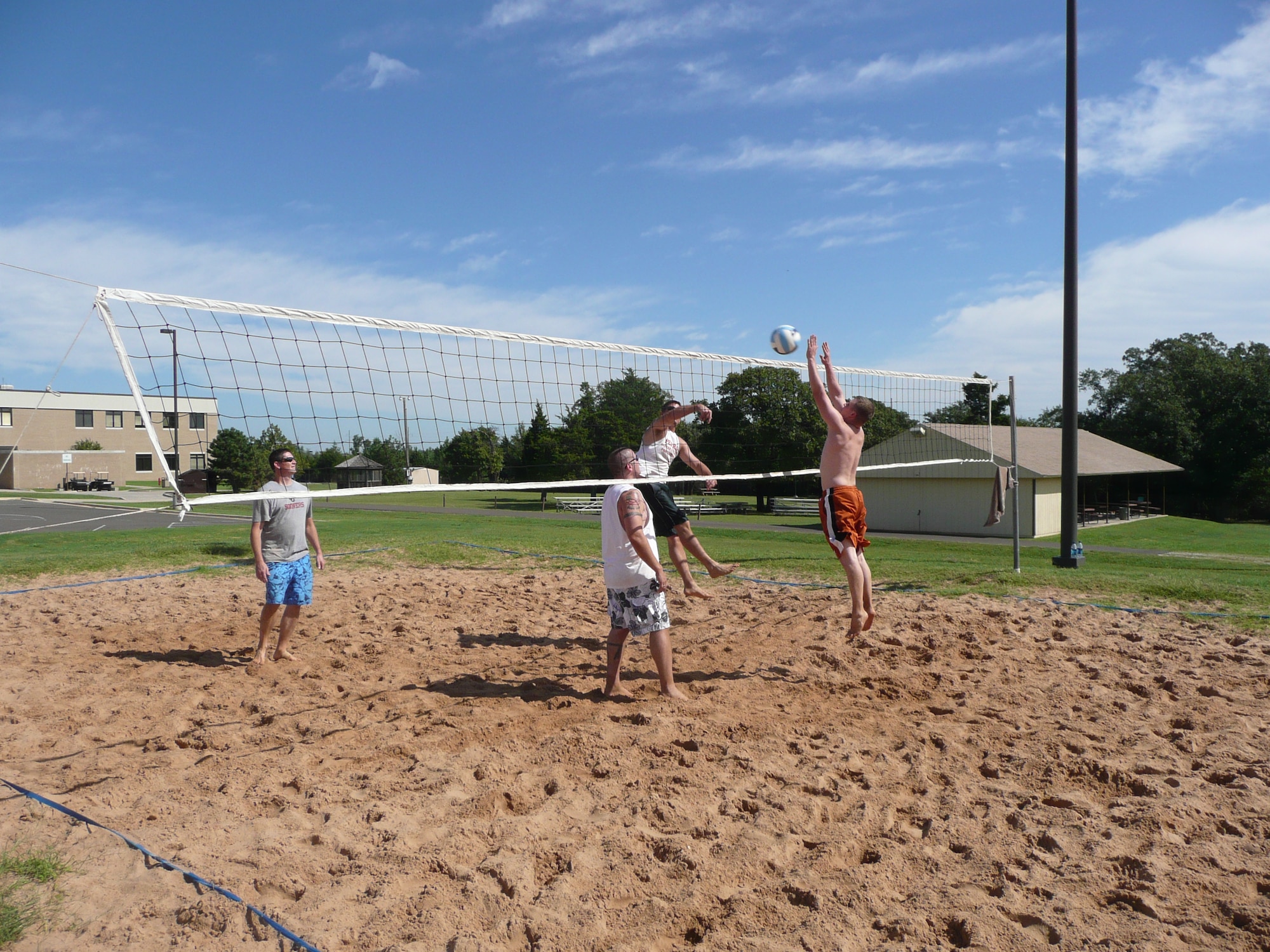 Kyle Parrish of Roc ‘em Soc ‘em, right, tries to block the shot of Lazy Lizards Matt Snyder during the annual Sand Volleyball Tournament Sept. 25. The Lizards won the round-robin tournament. (Air Force photo by Brandice J. Armstrong)