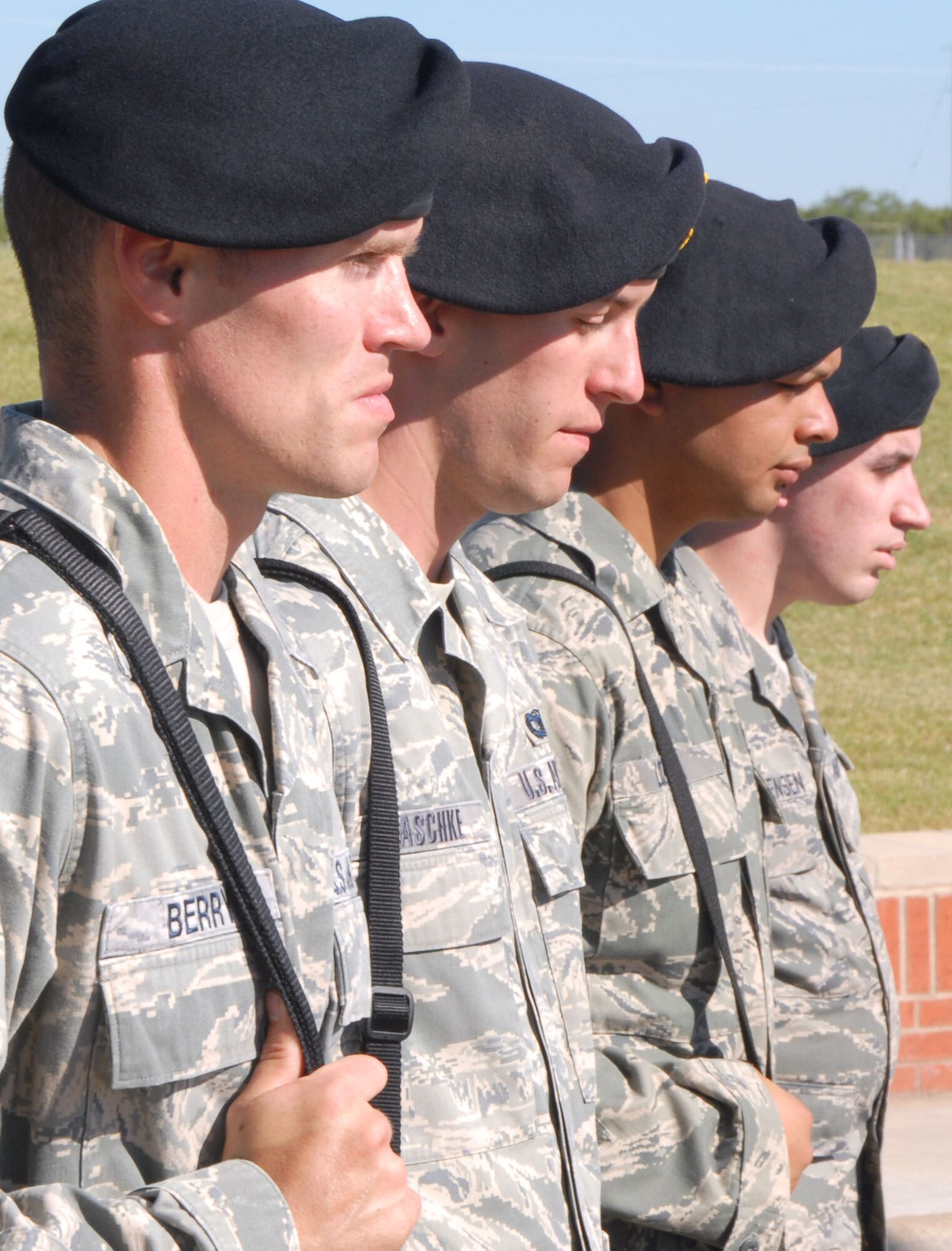 GOODFELLOW AIR FORCE BASE, Texas -- 17th Security Forces Squadron members wait in somber silence for Retreat to sound here Sept 28 during a ceremony commemorating the 5th anniversary of Airman 1st Class Elizabeth N. Jacobson's death. Airman Jacobson was the first Security Forces member and the first Air Force female to be killed in action in Iraq. (U.S. Air Force photo/Airman 1st Class Jessica D. Keith)