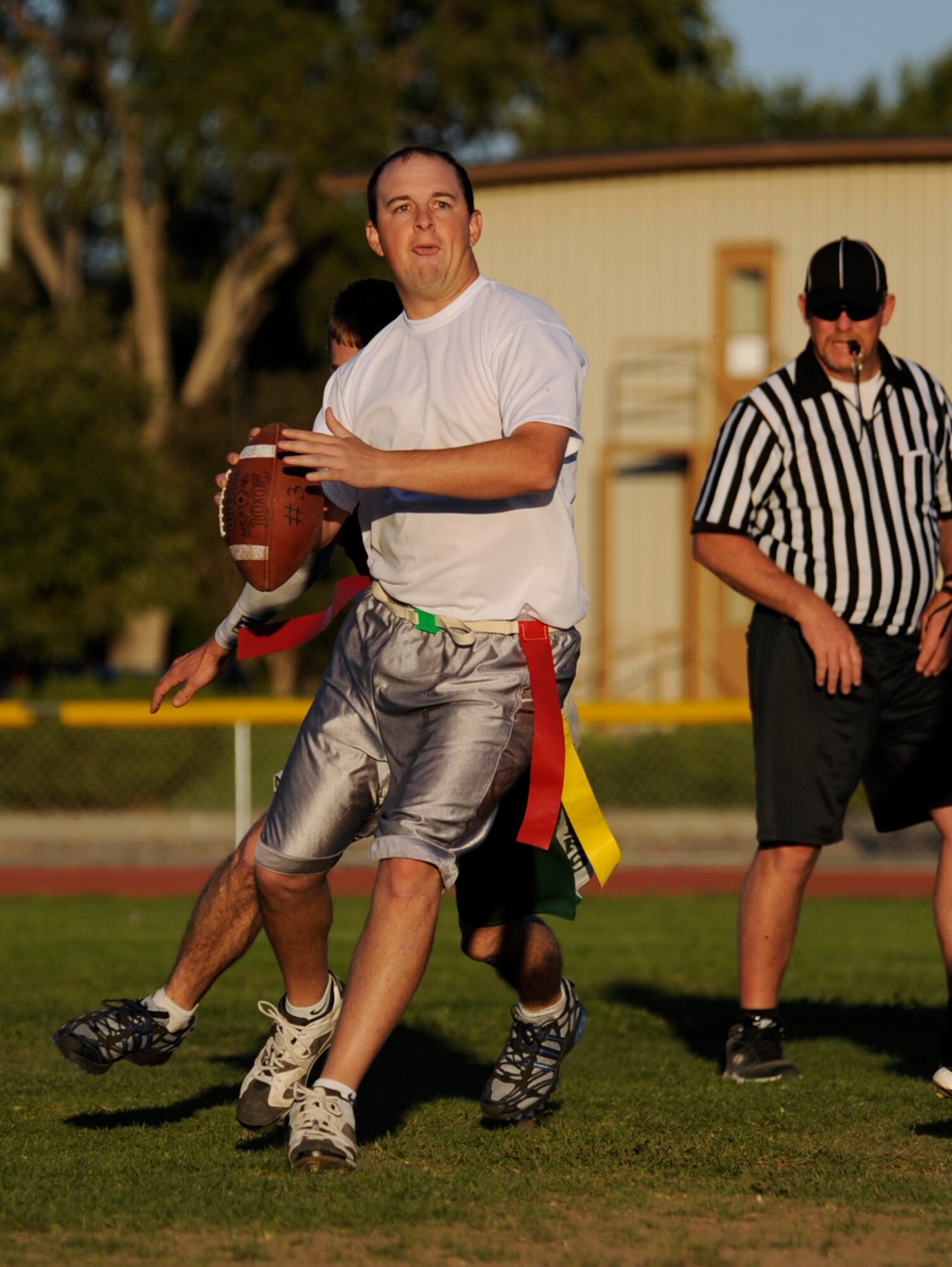 MOUNTAIN HOME AIR FORCE BASE, Idaho -- Matthew James, Component Maintenance Squadron "A" quarterback, looks for an open man down field during an intramural football game Sept. 23. CMS "A" soundly beat the Operation Support Squadron 48-0. (U.S. Air Force photo by Senior Airman Renishia Richardson)