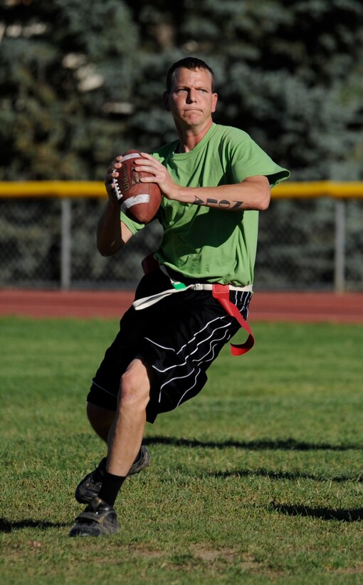MOUNTAIN HOME AIR FORCE BASE, Idaho -- Mark Fields, Security Force Squadron quarterback, looks for an open player down field during an intramural football game Sept. 23. SFS beat the Civil Engineering Squadron 15-7. (U.S. Air Force photo by Senior Airman Renishia Richardson)