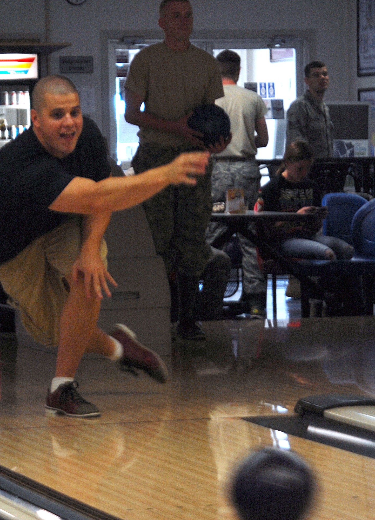 Senior Airman Jeremy Howt, 17th Communications Squadron, throws a strike at the Bowling Center here Sept 24. He and other members of Armed Forces Committed to Excellence spent the afternoon bowling as part of a morale-boosting event. (U.S. Air Force photo/Airman 1st Class Jessica D. Keith)