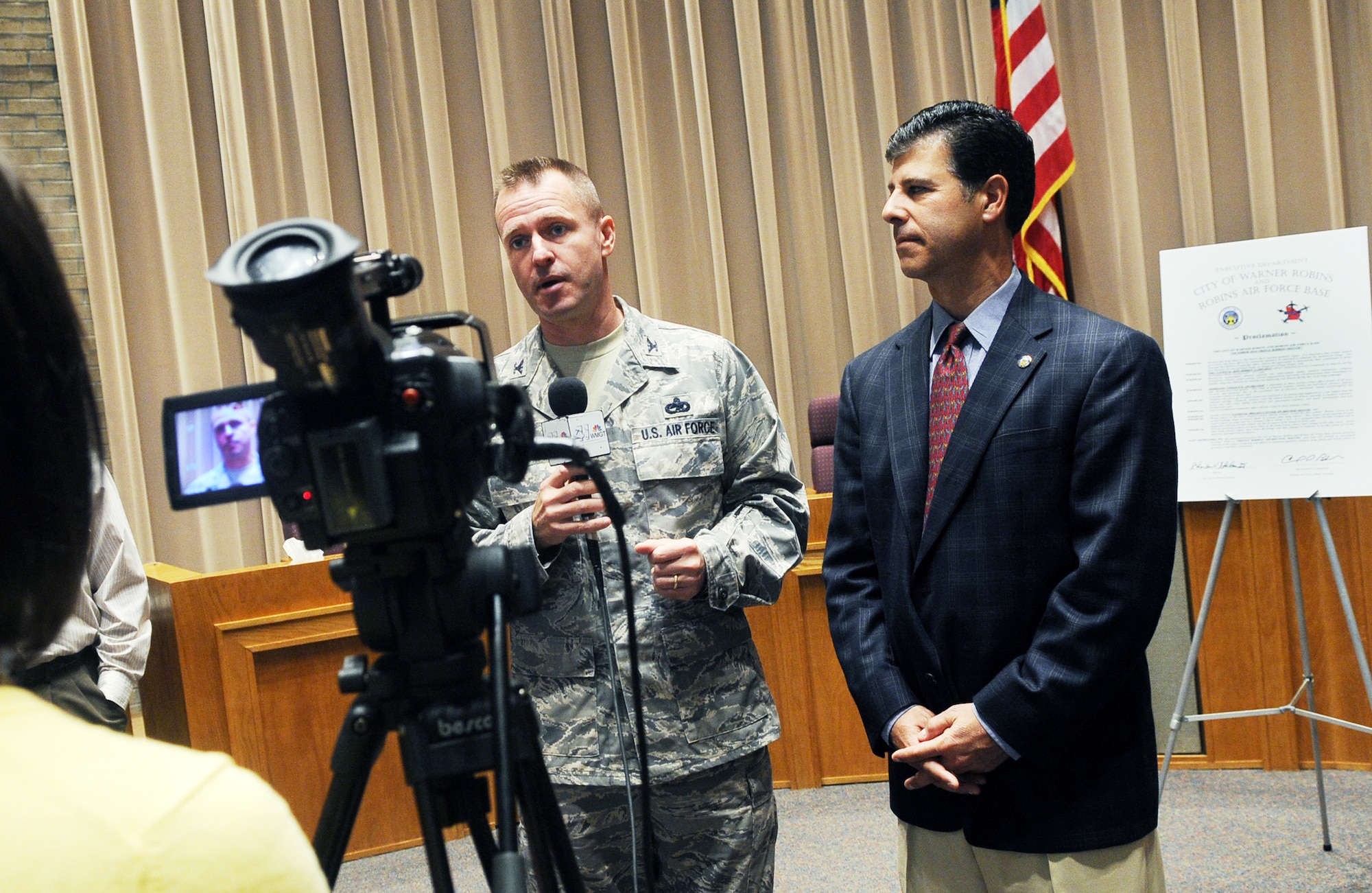 Col. Carl Buhler, 78th Air Base Wing commander and Warner Robins Mayor Chuck Shaheen talk with media after signing  a “Triple Ribbon Awareness Month” Proclamation Sept. 23 in honor of Breast Cancer Awareness Month, Domestic Violence Awareness Month, and Drug Awareness Month – all of which occur in the month of October. U. S. Air Force photo by Sue Sapp