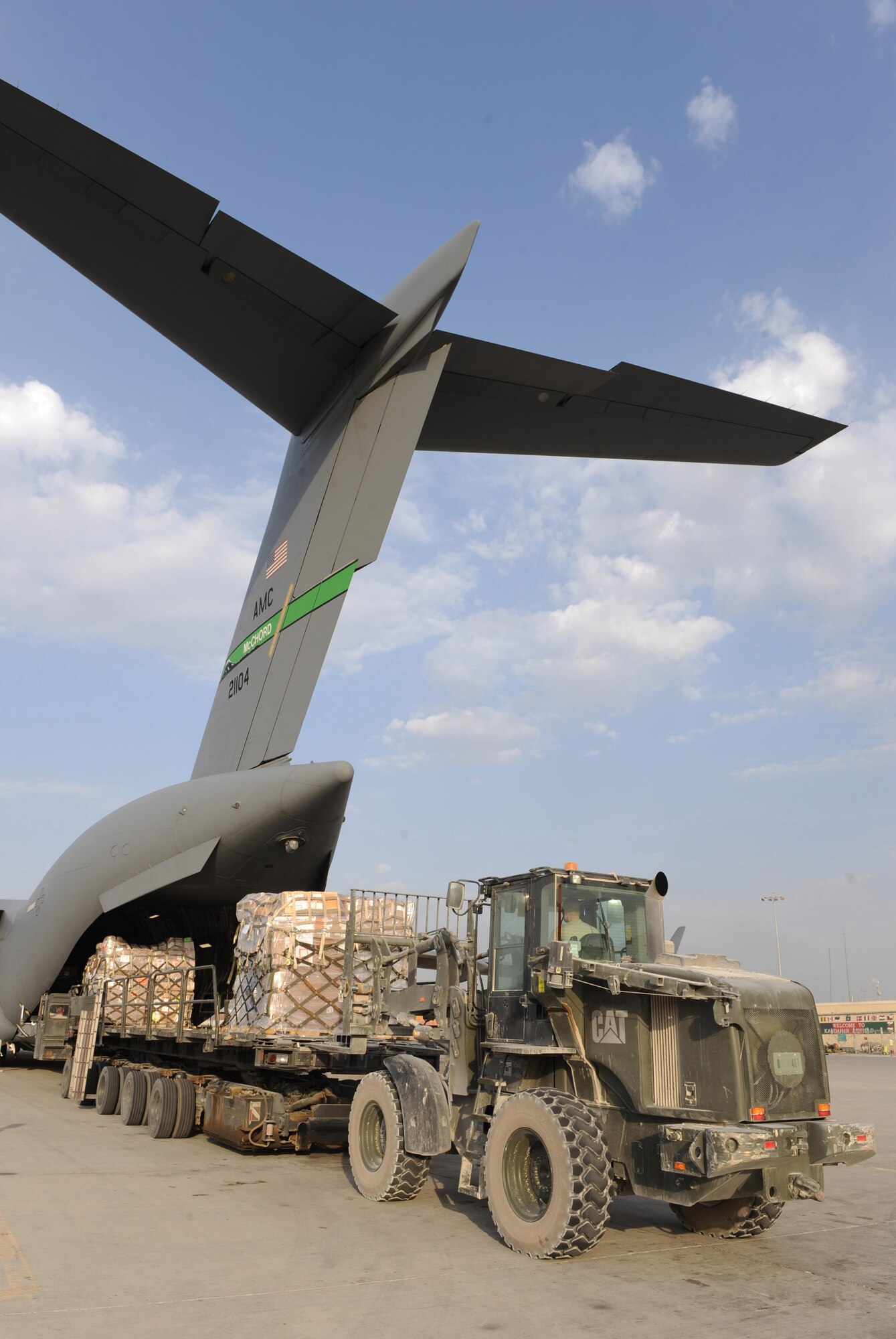 Airmen from the 451st Aerial Port Flight remove cargo from a C-17 Globemaster III during an engine-running offload Sept. 29, 2010, at Kandahar Airfield, Afghanistan.  The 451st APF handled more than 26 million pounds of cargo in the month of September. (U.S. Air Force photo by Tech. Sgt. Chad Chisholm/Released)