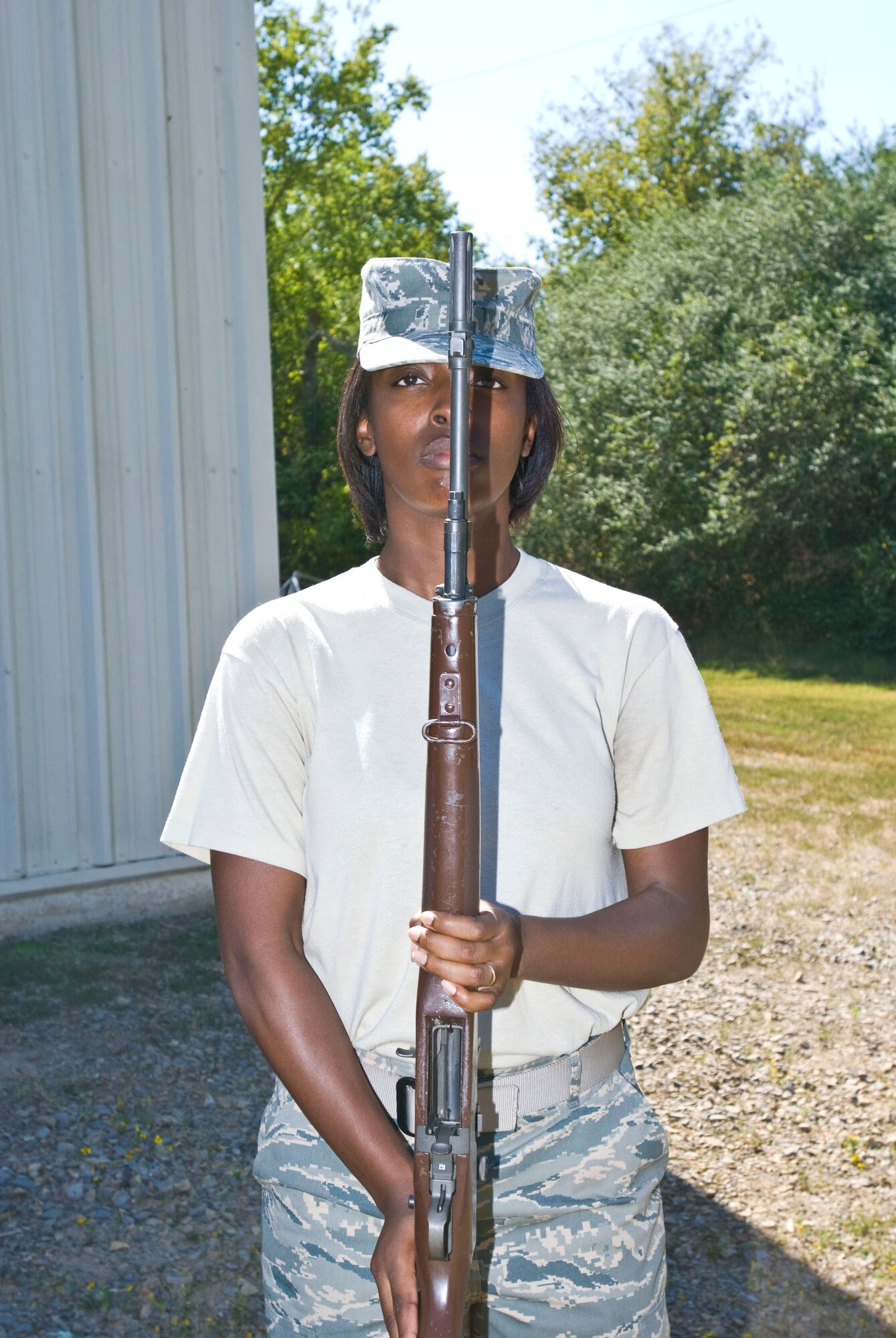 Senior Airman Daleah Baugh, 19th Operations Group, stands at attention with her rifle during a pre-test evaluation here Sept. 28. Base honor guard leaders say most honor guard members are senior airmen and below, but all ranks are welcome to join. (U.S. Air Force photo by Staff Sgt. Nestor Cruz)