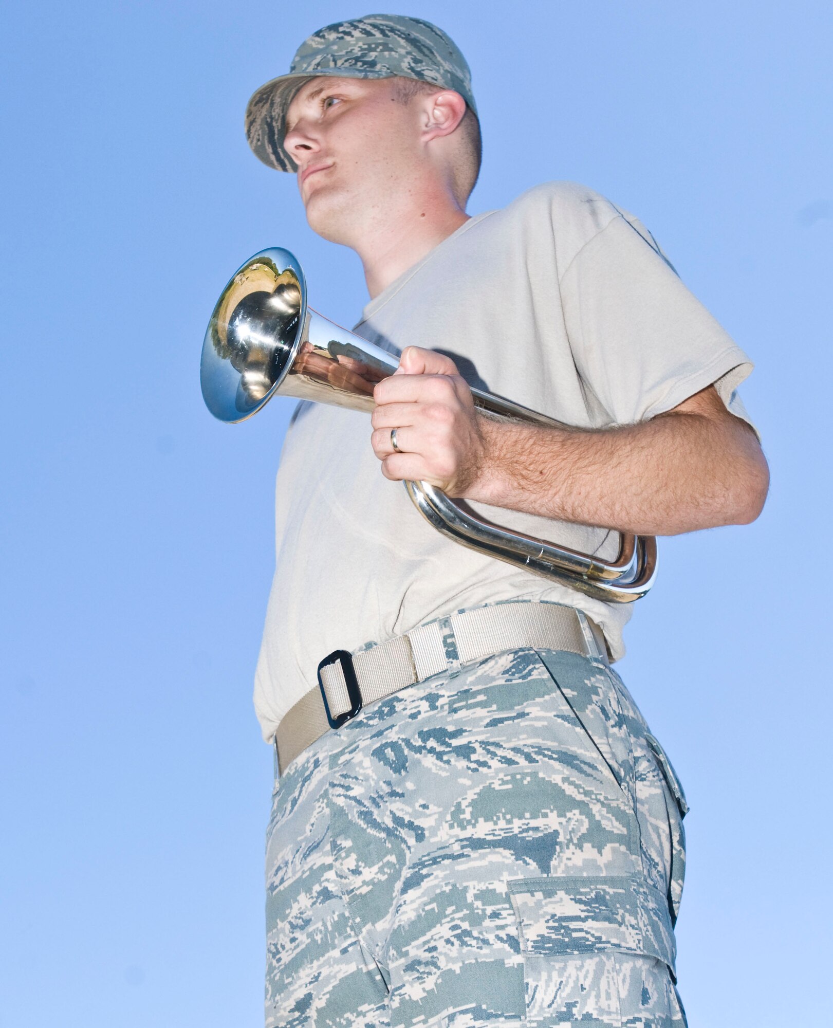Senior Airman Joseph Remington, 19th Logistics Readiness Squadron, stands at attention with his bugle during a pre-test evaluation here Sept. 28. Base honor guard members support various ceremonies across Arkansas including two counties in Tennessee. (U.S. Air Force photo by Staff Sgt. Nestor Cruz)