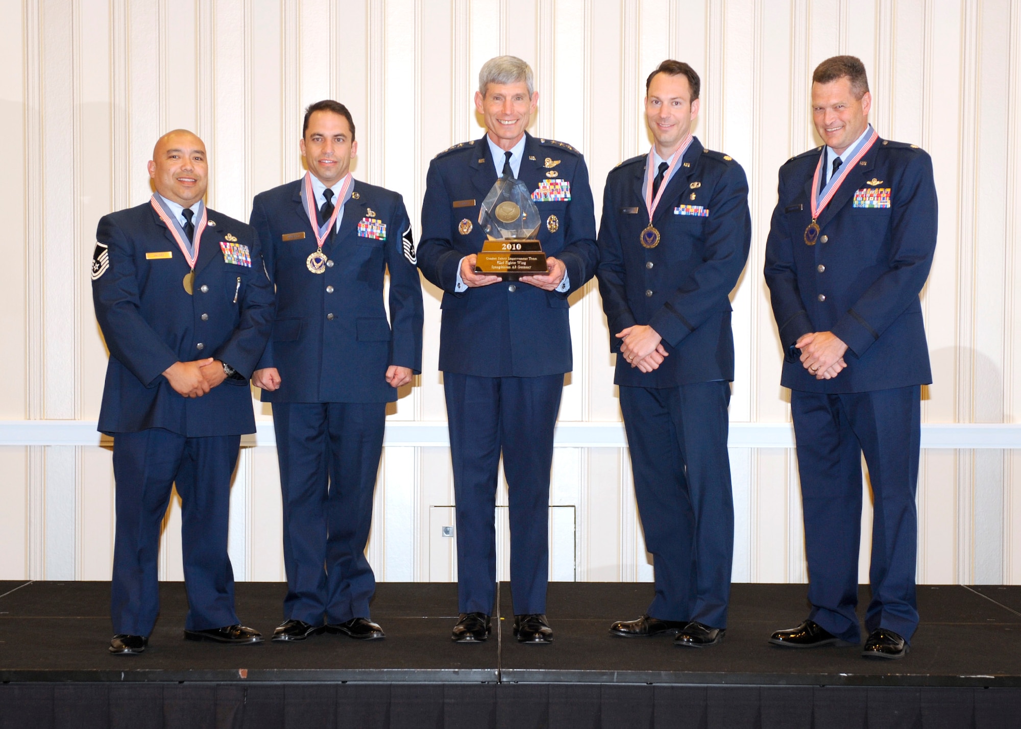WASHINGTON -- Gen. Norton Schwartz, Chief of Staff of the Air Force, center, presents the Chief of Staff Team Excellence Award to members of the 52nd Fighter Wing Safety Office Sept. 14. Master Sgt. Richard Valdez, Master Sgt. Joseph Winfield, Maj. Nathan Maertens and Lt. Col. James Thompson represented the combat safety improvement team and received the award for improved processes to save lives, preserve mission capability and accomplish the wing's combat role safely. (Courtesy photo)