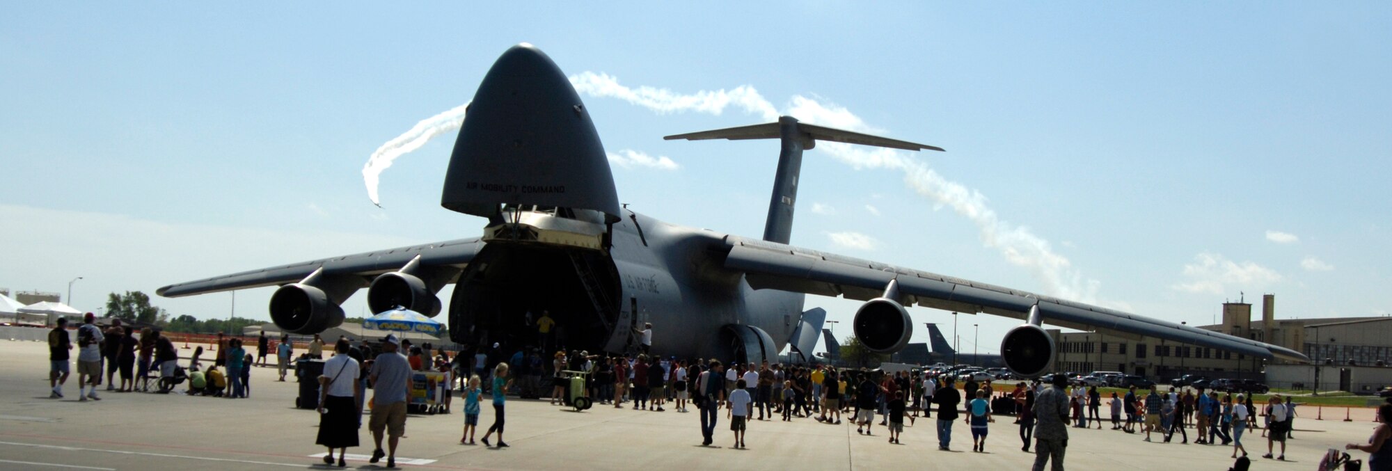 A C-5 Galaxy is on display to open house guests during the McConnell’s 2010 Open House and Air Show Sept. 25, 2010, McConnell Air Force Base, Kan. The two-day show featured many performances by military and civilian acts. Static displays were also available, and included tanks, aircraft and a C-5 loaded with an Army Mine Resistant Ambush Protected vehicle. (U.S. Air Force photo/Airman 1st Class Armando A. Schwier-Morales)