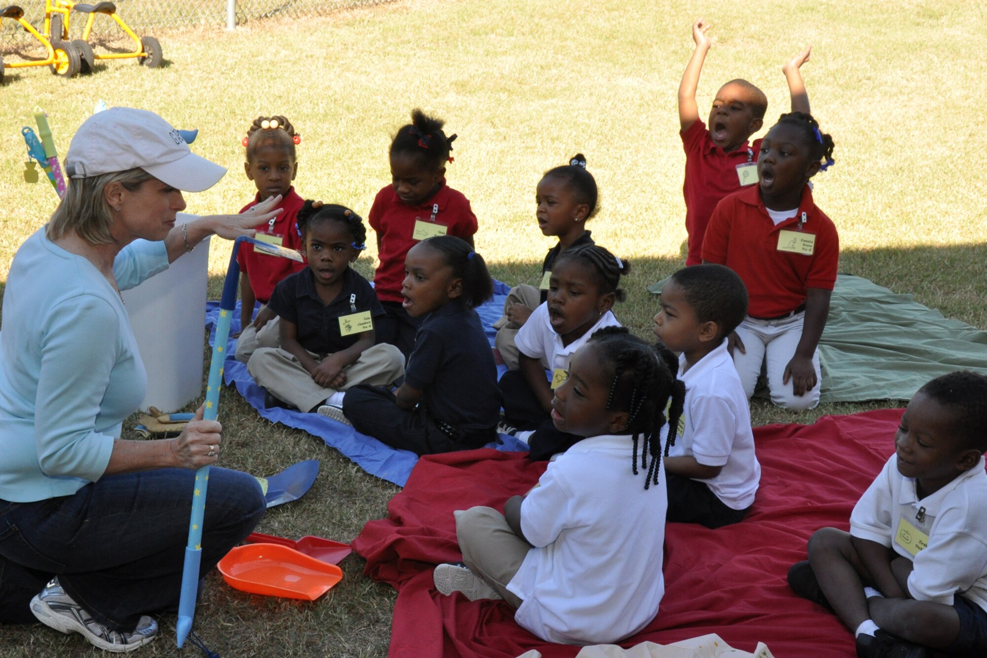 Mrs. Valli Webb instructs a group of Pre-K students about gardening tools before they will be able to help plant several flower bushes at Westwood Elementary School in Shreveport, La., Sept. 28, 2010.  Mrs. Webb, a Westwood Pre-K teacher, planned the planting project to allow her students the opportunity to see the growth of their efforts. Through the year, plans are to replace the flowers with seasonal plants and vegetables to be a continuing lesson for the students that could last a lifetime. Westwood Elementary supports children from Pre-K through 5th Grade. (U.S. Air Force photo/Tech. Sgt. Jeff Walston)