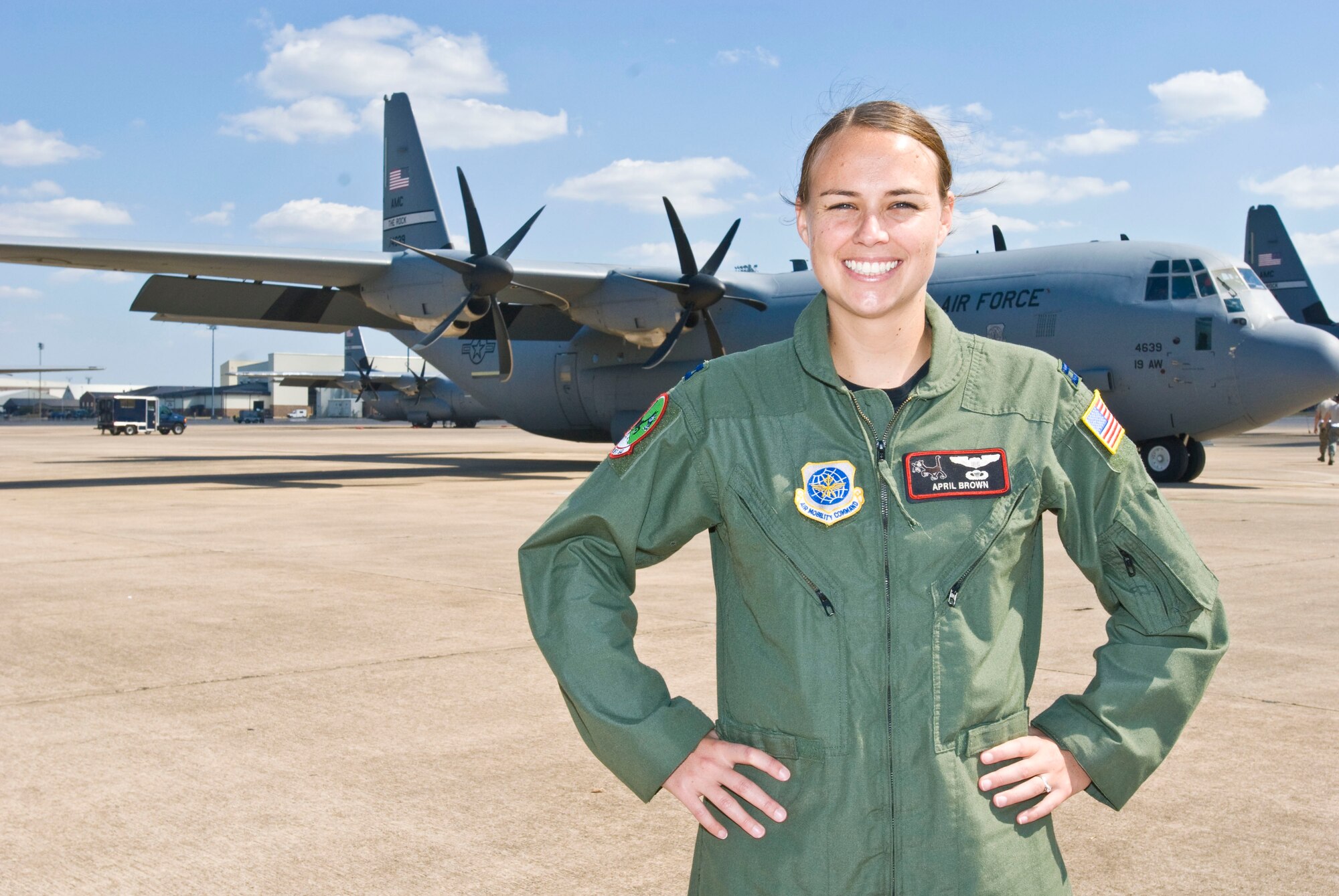 Capt. April Brown, 41st Airlift Squadron pilot and training officer, stands in front of a C-130J Sept. 29 here. At 10-years-old, Captain Brown became interested in flying while attending an air show at Marine Corps Air Station Miramar, Calif. (U.S. Air Force photo by Staff Sgt. Nestor Cruz)