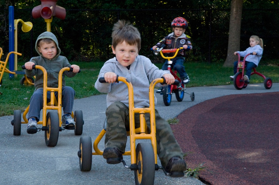 Children riding tricycles together.^[[Image](https://www.hanscom.af.mil/News/Photos/igphoto/2000320622/) by [Hanscom Air Force Base](https://www.hanscom.af.mil/) is in the public domain]