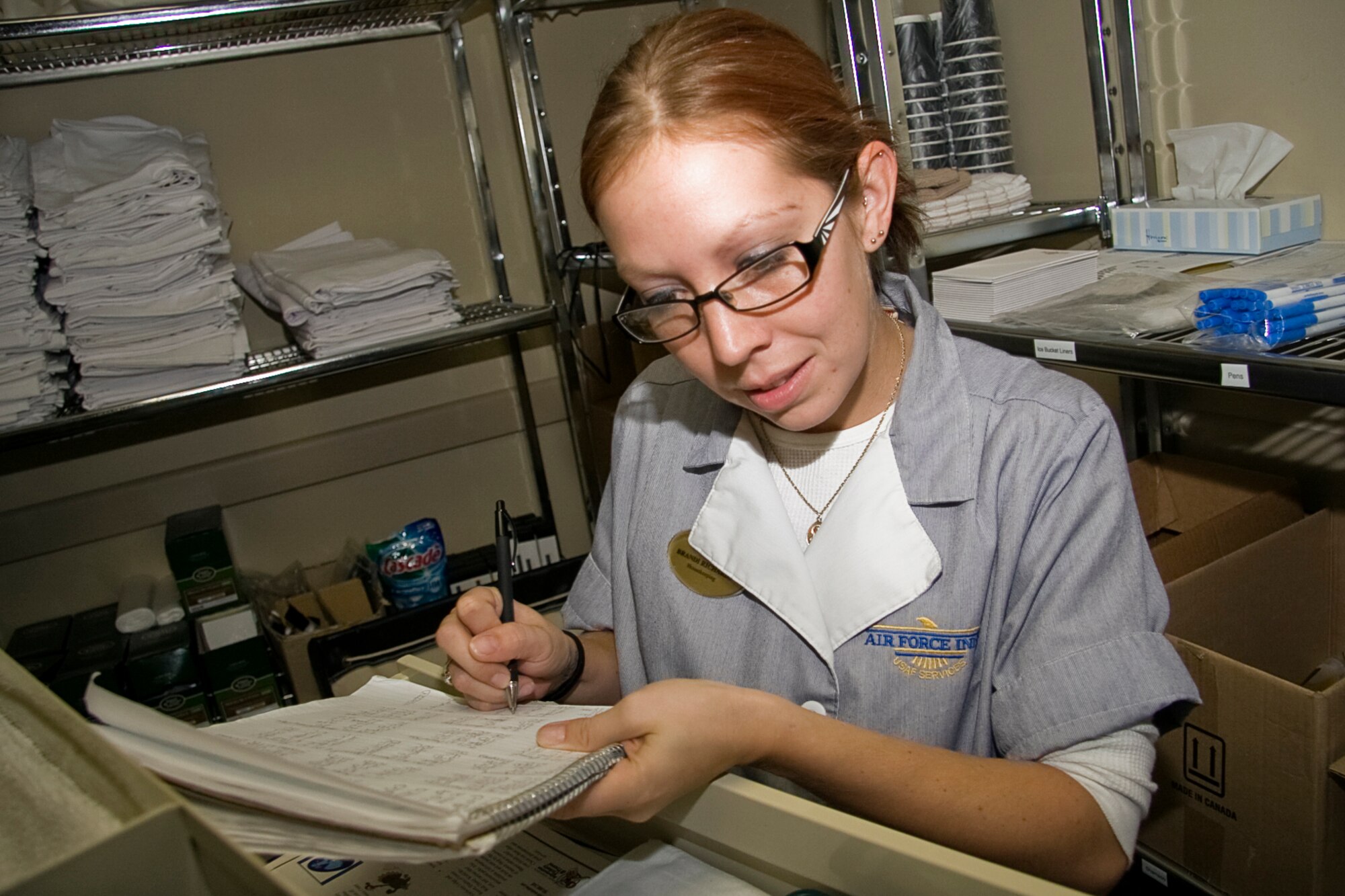 GRISSOM AIR RESERVE BASE, Ind. -- Brandi Richards, a custodial worker, fills out a logbook as she makes her daily rounds at the Grissom Inn on base. Each Air Force Inn undergoes a yearly certification process which requires a score of 85 percent to pass. The Grissom Inn earned a high grade of 94.5 percent, which puts the on-base lodging facility at the top of Air Force Inns. The checklist used to scrutinize our operation is extensive with a total of 452 graded areas and 1,783 possible points. This is the first time the Grissom Inn has scored this high on the certification, which is due in part to the many changes that have taken place at the facility recently. (U.S. Air Force photo/Tech. Sgt. Mark R. W. Orders-Woempner)