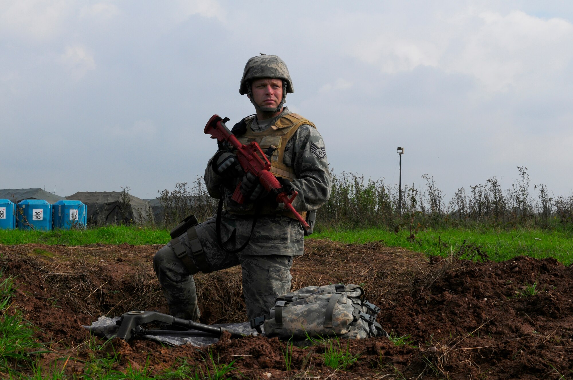 U.S. Air Force Staff Sgt. Darren Wiles, 435th Security Forces Squadron, stands as over watch to ensure safety of personnel during an Operational Readiness Inspection, Flugplatz Bitburg, Germany, Sept. 29, 2010.The ORI is designed to test Airmen?s ability to survive, operate and perform fundamental duties in a war time environment. (U.S. Air Force photo by Airman Kendra Alba)