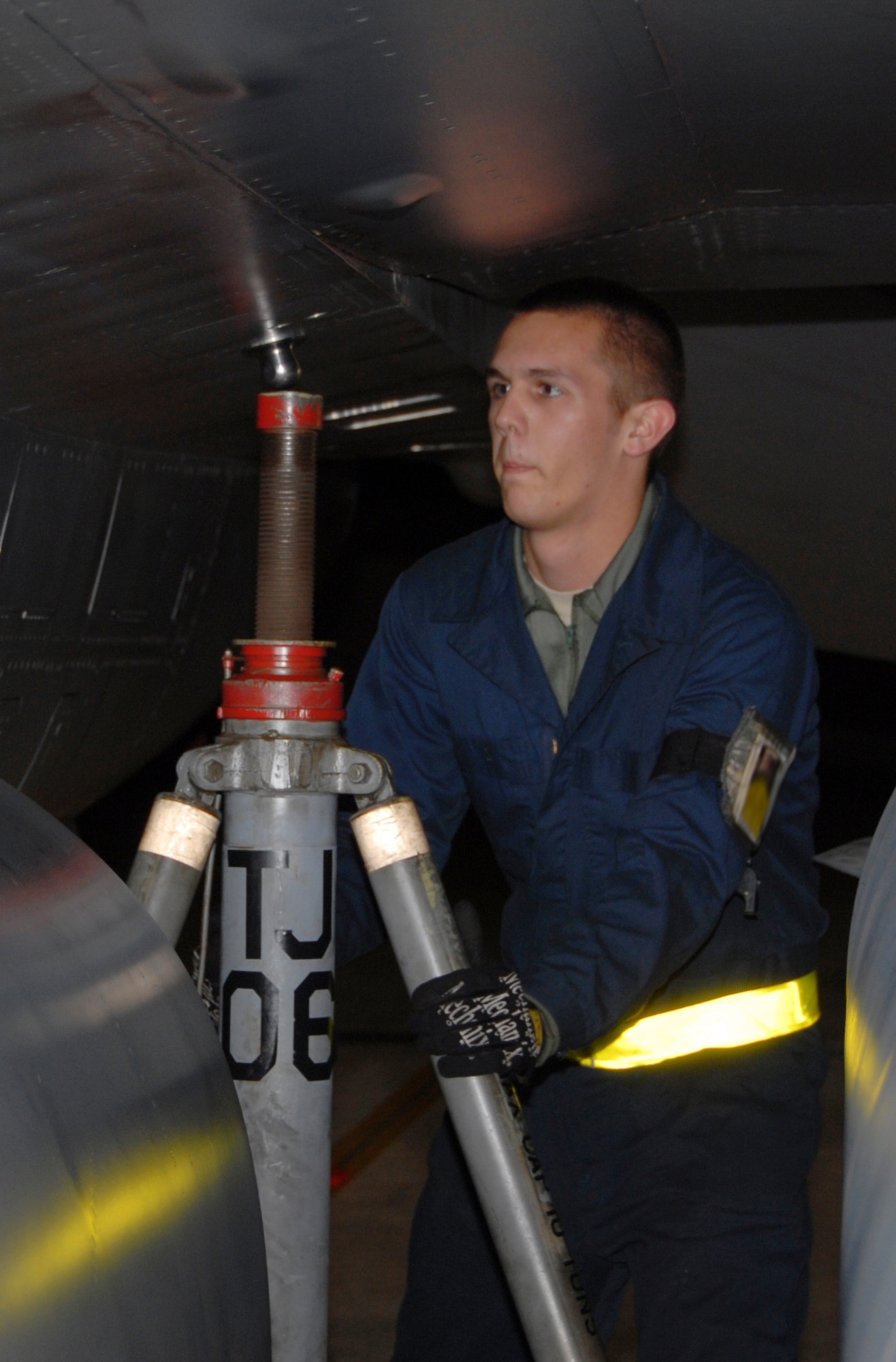 KUNSAN AIR BASE, Republic of Korea -- Airman First Class Grant Gibbons, 8th Aircraft Maintenance Squadron 80th Aircraft Maintenance Unit crew chief, seats a tripod jack on an F-16 Fighting Falcon. The 8th AMXS maintainers were crucial to the 8th Fighter Wing zeroing out its flying hour program for 2010. (U.S. Air Force photo/Staff Sgt. Amanda Savannah)