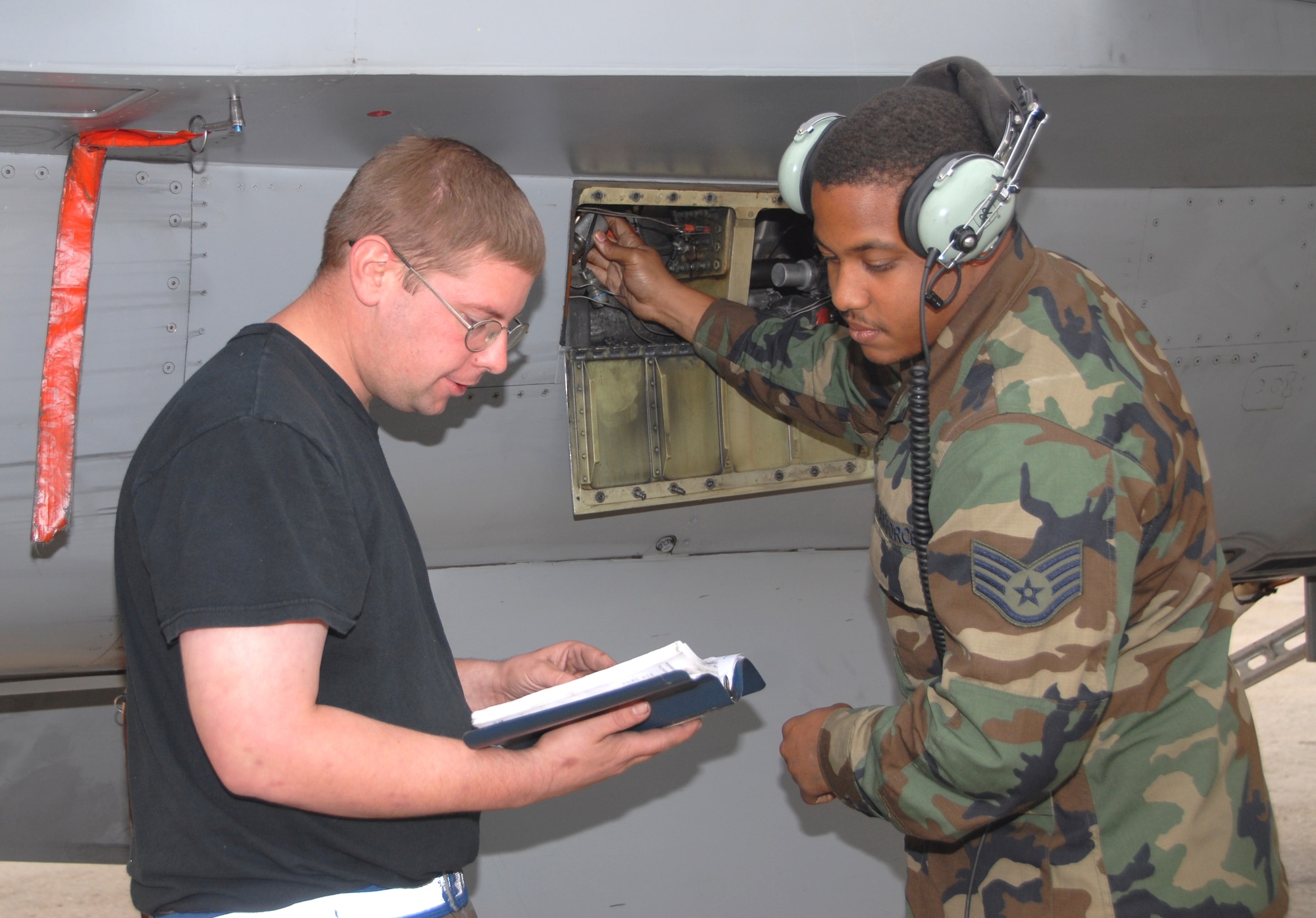 KUNSAN AIR BASE, Republic of Korea -- Staff Sgts. Michael Ray and Carlos Gardner, 8th Aircraft Maintenance Squadron 35th Aircraft Maintenance Unit aerospace propulsion craftsmen, run a low-energy ignition operations check on an F-16 Fighting Falcon. The 8th AMXS maintainers were crucial to the 8th Fighter Wing zeroing out its flying hour program for 2010. (U.S. Air Force photo/Staff Sgt. Amanda Savannah)