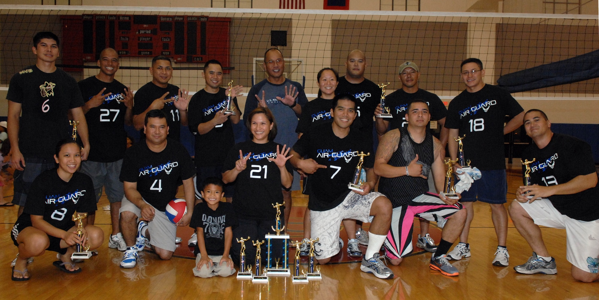 The 254th Air National Guard volleyball team poses with their intramural volleyball season first-place trophies at the Coral Reef Fitness Center Sept. 24.The 254th team was crowned champions after narrowly defeating the 734th Air Mobility Squadron, 2-1, during the 2010 Intramural Volleyball Championship Sept. 24, at the Coral Reef Fitness Center. (U.S. Air Force photo/Airman Julian North)
