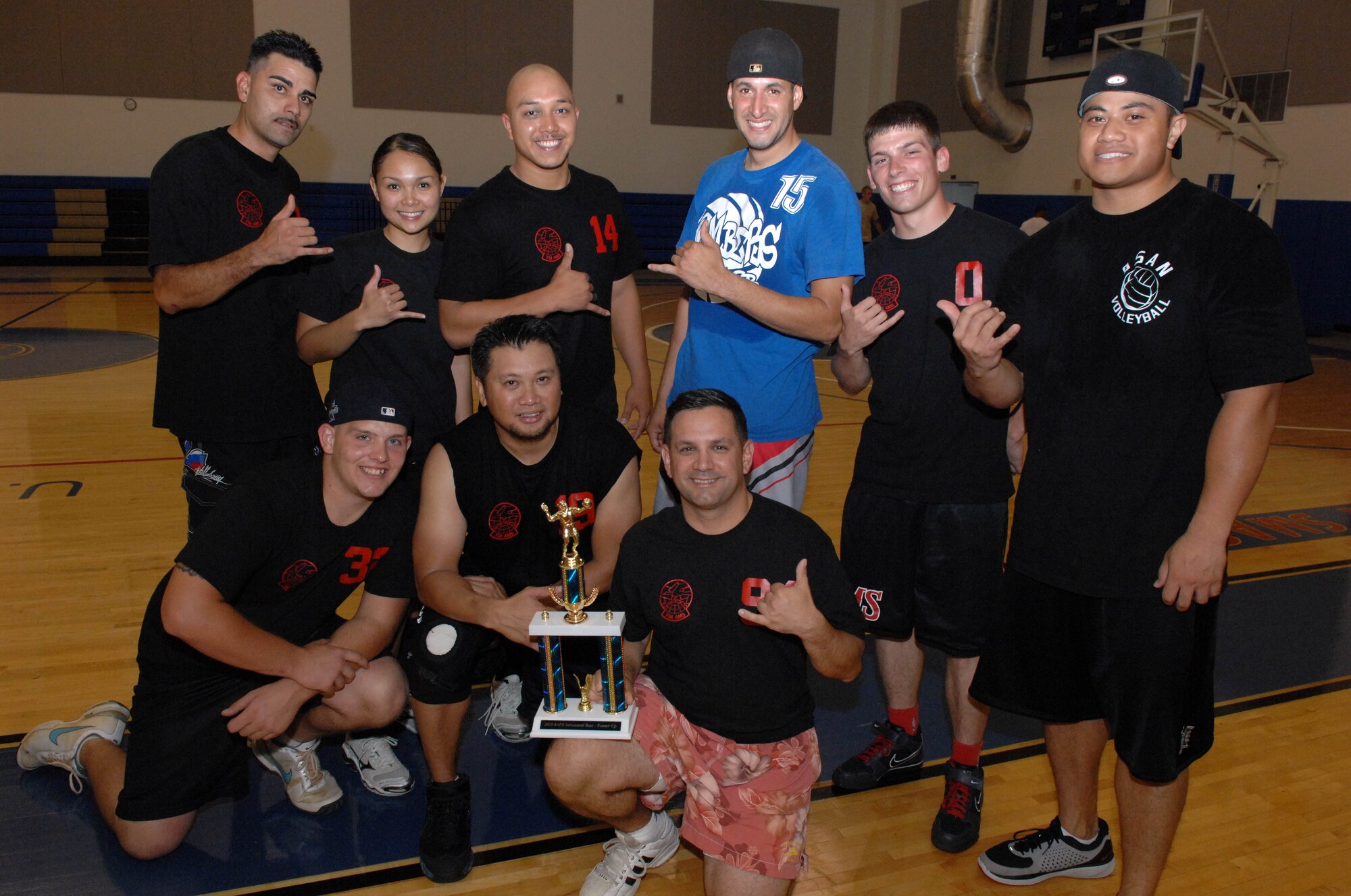 The 734th Air Mobility Squadron volleyball team poses with their intramural volleyball season second-place trophies at the Coral Reef Fitness Center Sept. 24. The 254th Air National Guard were crowned champions after narrowly defeating the 734th, 2-1, during the 2010 Intramural Volleyball Championship. (U.S. Air Force photo/Airman Julian North)
