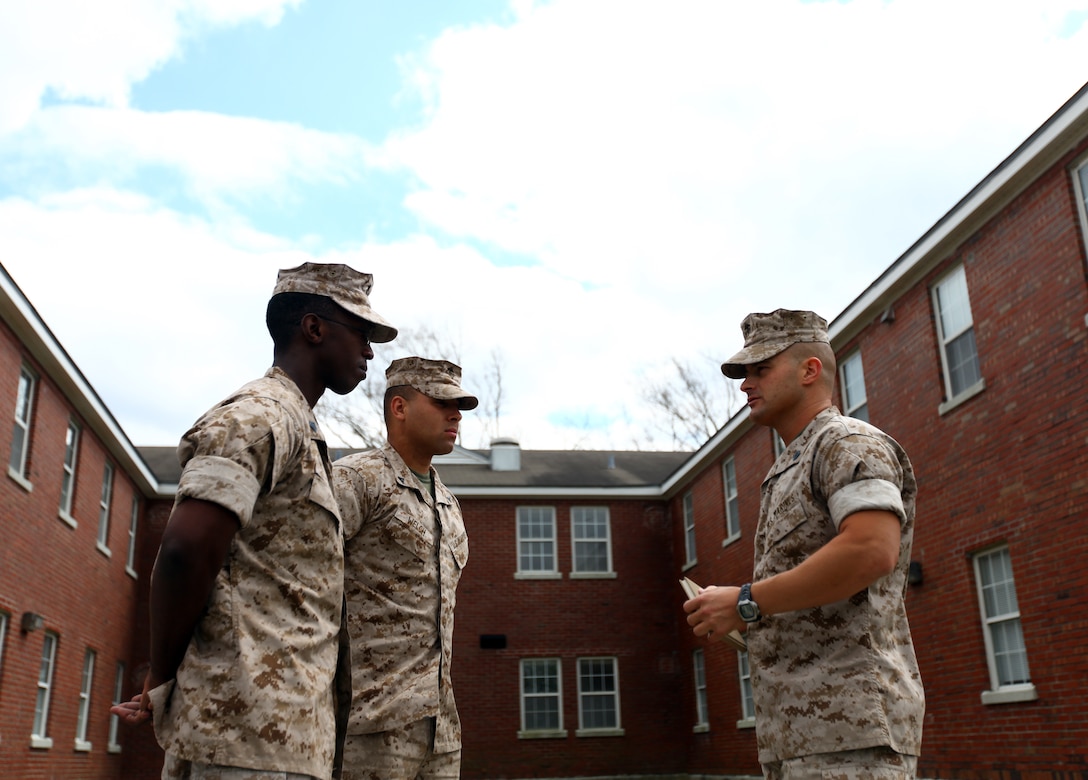 Gunnery Sergeant Daniel C. Morning, the company gunnery sergeant for Headquarters Company, Headquarters Battalion, 2nd Marine Division, talks with Marines within his company aboard Marine Corps Base Camp Lejeune N.C., April 1, 2011. Morning is responsible for 27 different work sections and the welfare of more than 900 Marines and sailors.