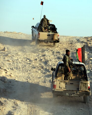 Afghan National Security Forces vehicles travel from Forward Operating Base Jackson, Afghanistan, to FOB Delaram, Afghanistan, April 1, 2011, during a combat logistics patrol.  The convoy, which was to resupply the 2nd Kandak of the Afghan National Army, consisted of soldiers with the 5th Kandak of the ANA and Marines and sailors with the Embedded Partnering Team, Combat Logistics Patrol 8, 2nd Marine Logistics Group (Forward), and also served as a training mission for the ANA.