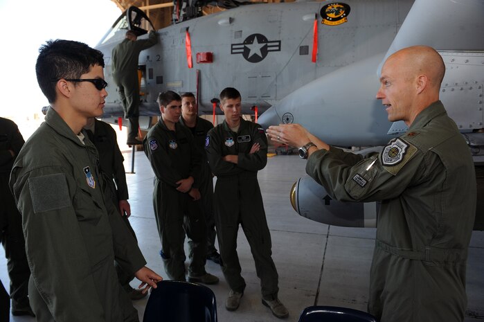 NELLIS AIR FORCE BASE, Nev. -- Maj. Marty Garrett, 57th Operations Support Squadron director of operations, describes how an A-10 Thunderbolt II flies to U.S. Air Force Academy cadets, April 1. The purpose of this visit was to motivate cadets to pursue a career in the Air Force by exposing them to the many ways Nellis Airmen support the war effort.(U.S. Air Force photo by Senior Airman Brett Clashman)