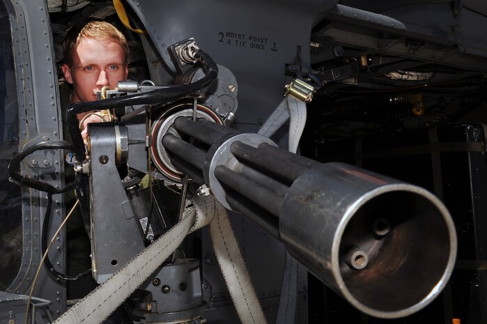 NELLIS AIR FORCE BASE, Nev. -- Cadet 3rd Class Andrew Watson, U.S. Air Force Academy cadet, operates a minigun on a HH-60 Pave Hawk, April 1. The purpose of this visit was to motivate cadets to pursue a career in the Air Force by exposing them to the many ways Nellis Airmen support the war effort.(U.S. Air Force photo by Senior Airman Brett Clashman)