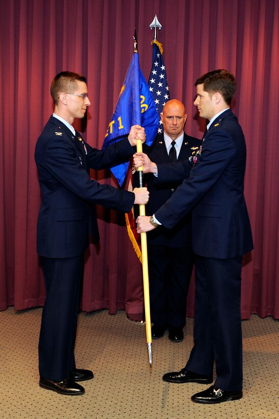 (Right) Maj. Chris Clark assumes command of Detachment 1 of the 28th Operations Group on Ellsworth Air Force Base, S.D., April 1, 2011.   The 432nd Attack Squadron is scheduled for reactivation next year, with ground control stations for MQ-9 Reapers assigned to it. Until then, Det. 1 will lay the groundwork in preparation for the incoming squadron. (U.S. Air Force photo/Staff Sgt. Marc I. Lane)