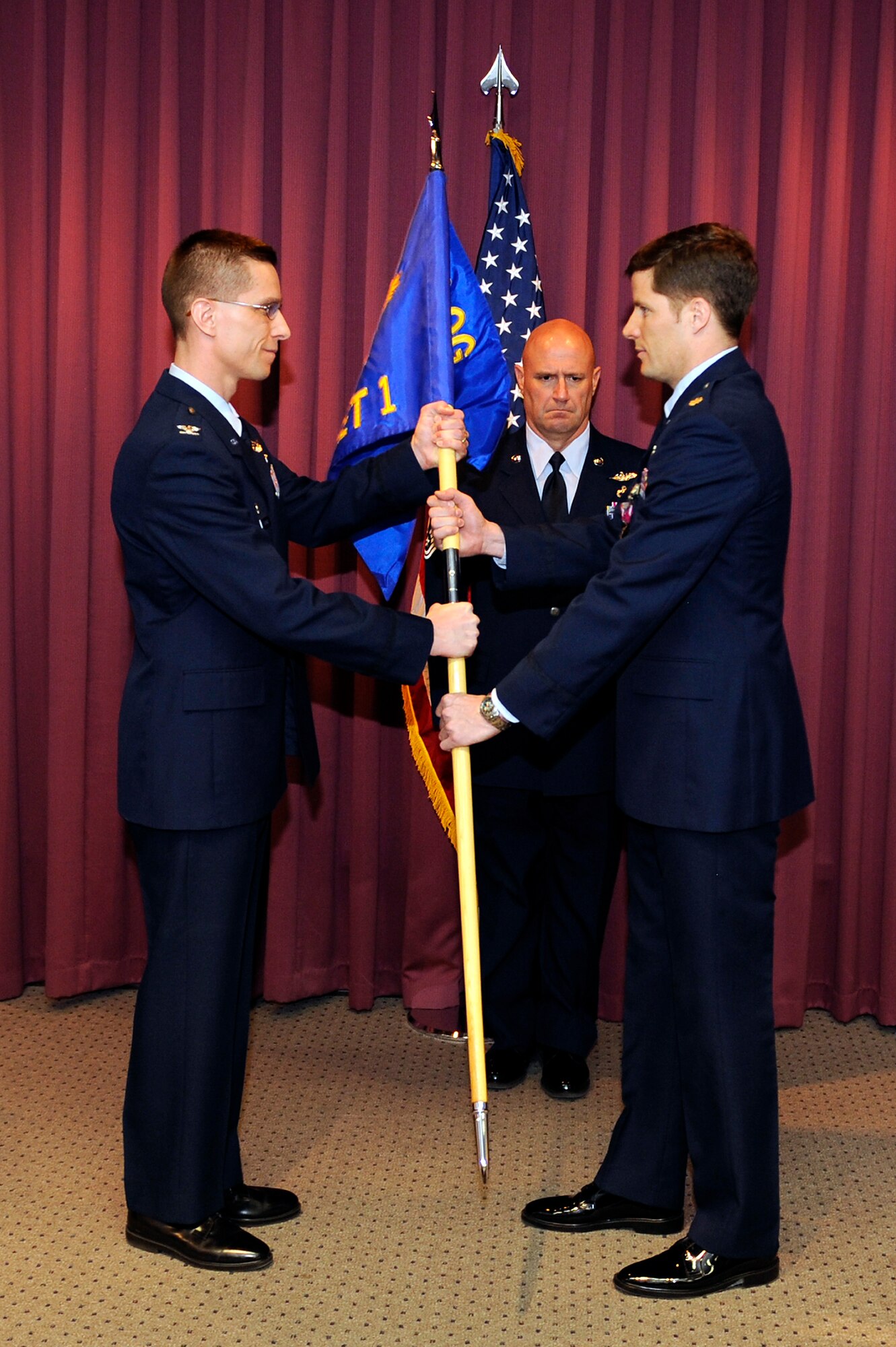 (Right) Maj. Chris Clark assumes command of Detachment 1 of the 28th Operations Group on Ellsworth Air Force Base, S.D., April 1, 2011.   The 432nd Attack Squadron is scheduled for reactivation next year, with ground control stations for MQ-9 Reapers assigned to it. Until then, Det. 1 will lay the groundwork in preparation for the incoming squadron. (U.S. Air Force photo/Staff Sgt. Marc I. Lane)