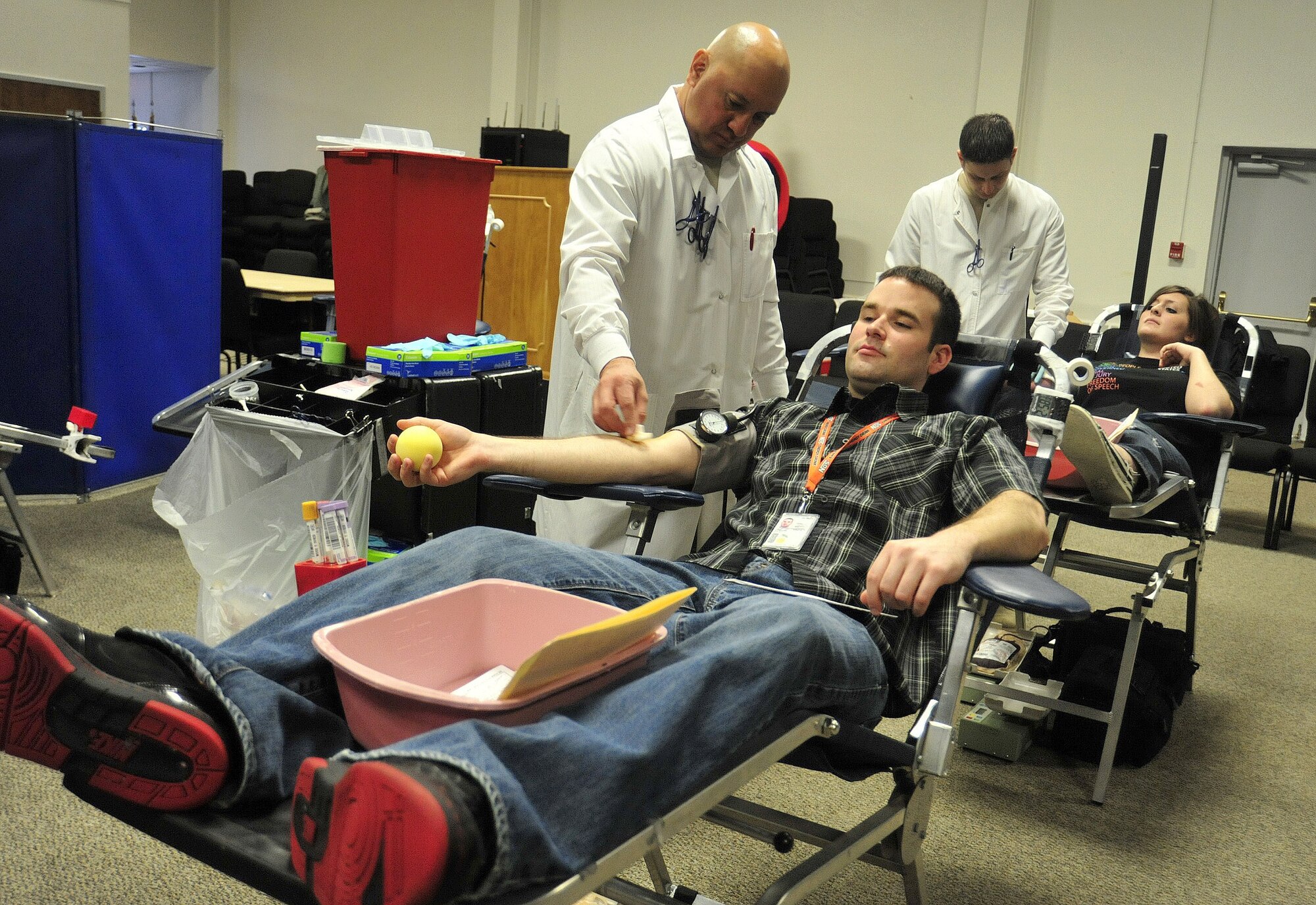 Adam Passmore, right, prepares to have blood taken at an Armed Services Blood Bank Center blood drive March 30 at Joint Base Lewis-McChord, Wash. (U.S. Air Force photo/Airman 1st Class Leah Young)