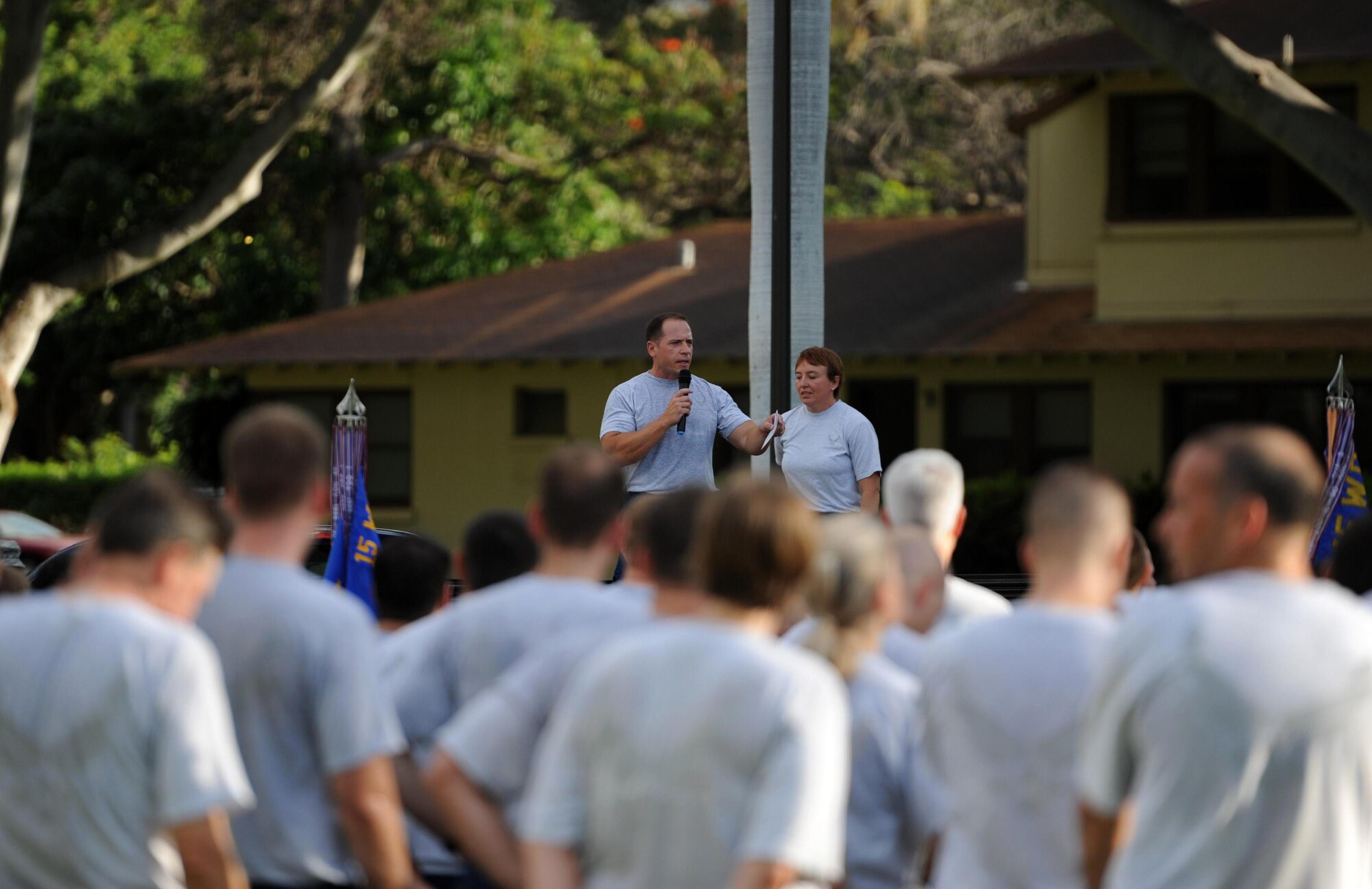 Lt. Col. Christopher Dun, 15th Medical Group vice commander, congratulates Airmen on a good run after completion of the  monthly "Warrior Run" Apr. 1 which begins and ends at Hickam Mall. The run, which spans approximately two miles, was hosted this month by the 15th Medical Group. (U.S. Air Force photo by Staff Sgt. Nathan Allen)