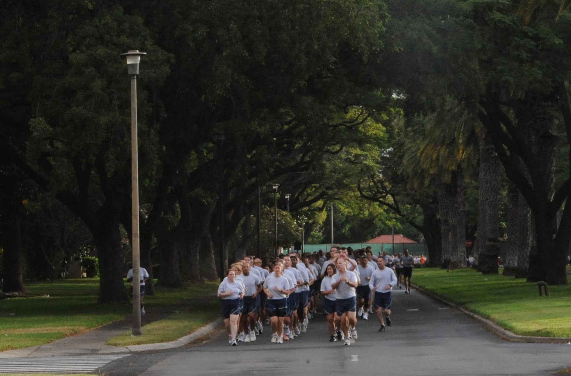 Airmen from Joint Base Pearl Harbor-Hickam, Hawaii, participate in the monthly "Warrior Run" Apr. 1 which begins and ends at Hickam Mall. The run, which spans approximately two miles, was hosted this month by the 15th Medical Group. (U.S. Air Force photo by Staff Sgt. Nathan Allen)