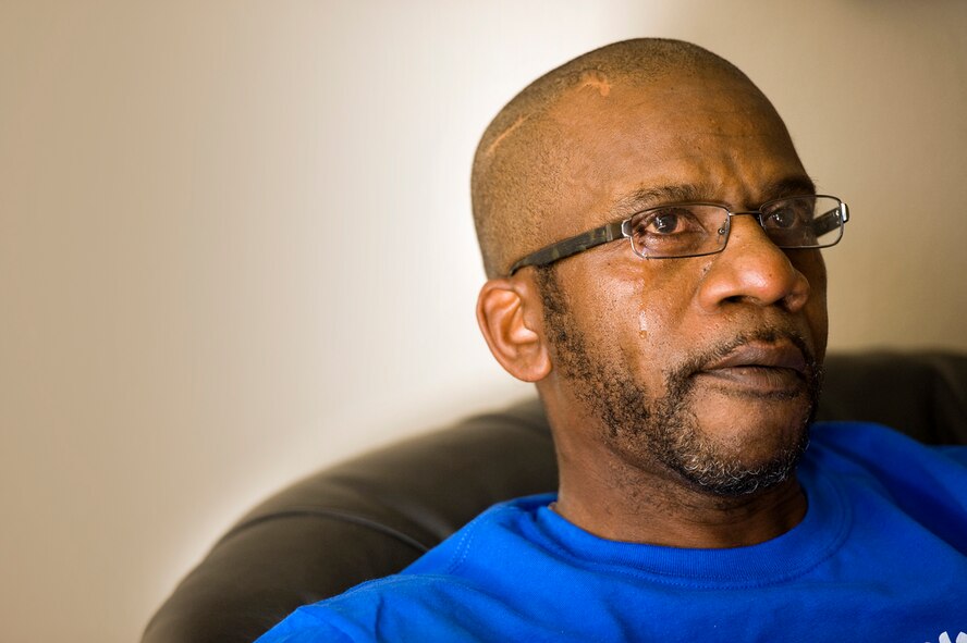 With a tear streaming down his cheek, retired Master Sgt. Ronald Lee said he never expected to outlive any of his children. But he saw Audra buried April 21, 2009, at Fort Sam, Texas. Above, Anika Lee, Nathanial's aunt, takes a moment to collect herself before continuing to talk about losing her best friend ? older sister Audra ? and the void it has left in her life. 
(Photos by Samuel Bendet)
