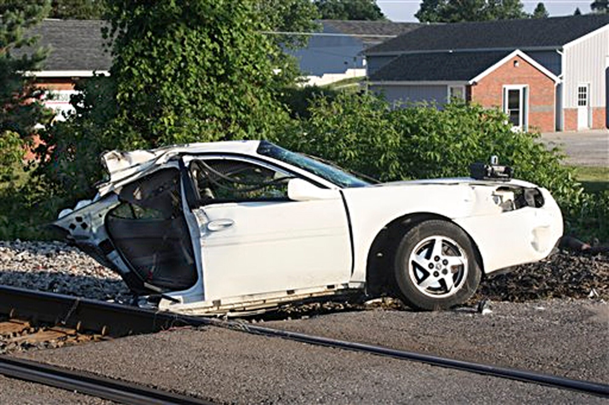An Amtrak Train sheered this Pontiac Grand Prix in half after the two collided in a June mishap. Adam Brimmer, the driver of the vehicle, survived the crash with only a couple of superficial scratches and a bruise. (Courtesy of Lapeer County Sheriff's Office)