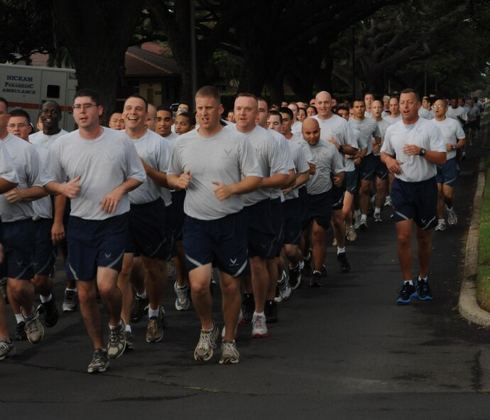 Airmen from Joint Base Pearl Harbor-Hickam, Hawaii, participate in the monthly "Warrior Run" Apr. 1 which begins and ends at Hickam Mall. The run, which spans approximately two miles, was hosted this month by the 15th Medical Group. (U.S. Air Force photo by Staff Sgt. Nathan Allen)