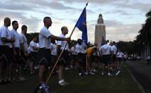 Airmen from the 647th Security Forces Squadron  at Joint Base Pearl Harbor-Hickam, Hawaii, prepare to participate in the monthly "Warrior Run" Apr. 1 which begins and ends at Hickam Mall. The run, which spans approximately two miles, was hosted this month by the 15th Medical Group. (U.S. Air Force photo by Staff Sgt. Nathan Allen)