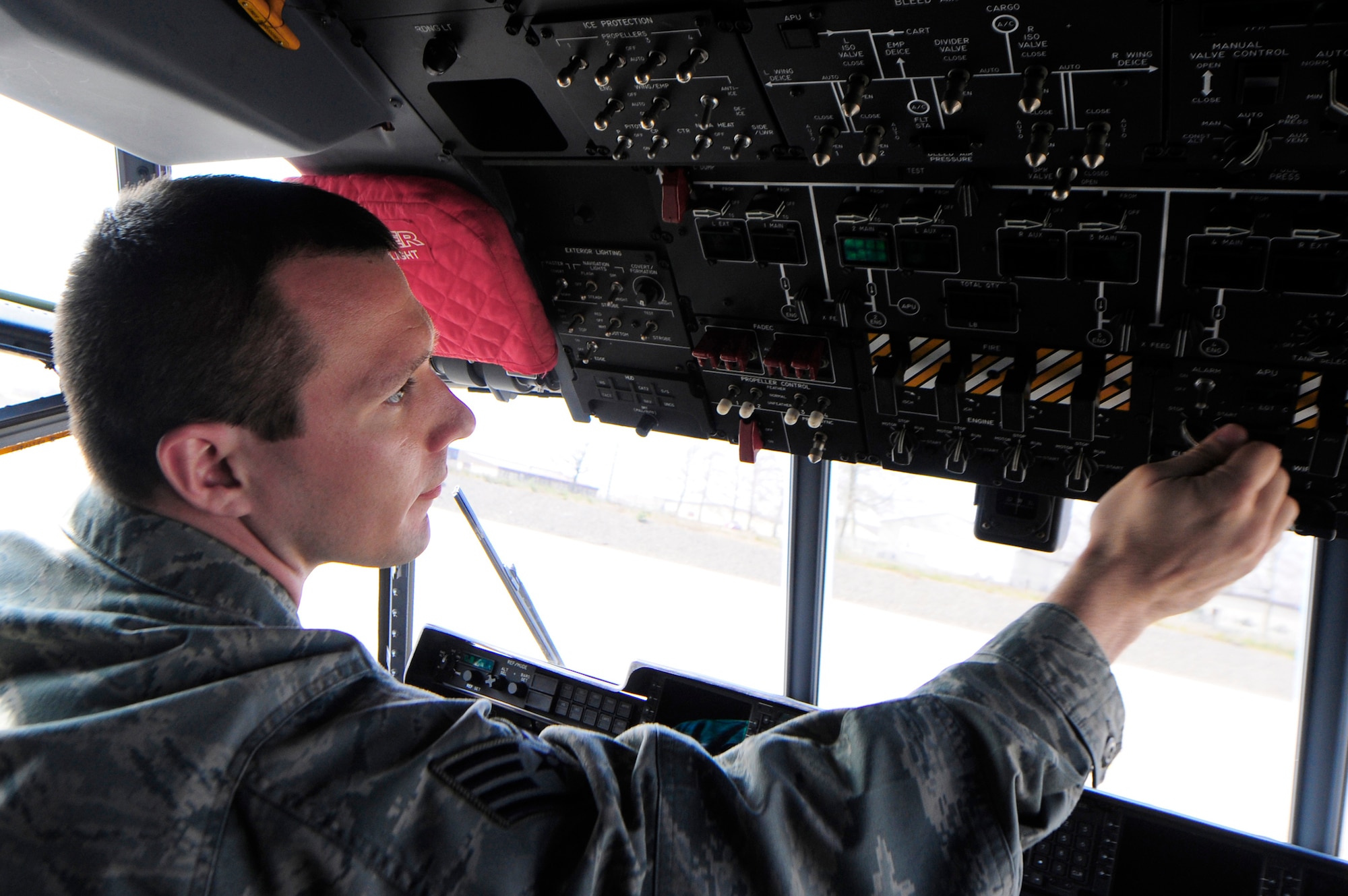 Staff Sgt. Michael Moomaw performs a post-flight inspection on a C-130J Super Hercules March 25, 2011, at Ramstein Air Base, Germany, after its return from a mission in support of Operation Odyssey Dawn. Moomaw is assigned to the 86th Aircraft Maintenance Squadron. (U.S. Air Force photo/Airman 1st Class Brea Miller)